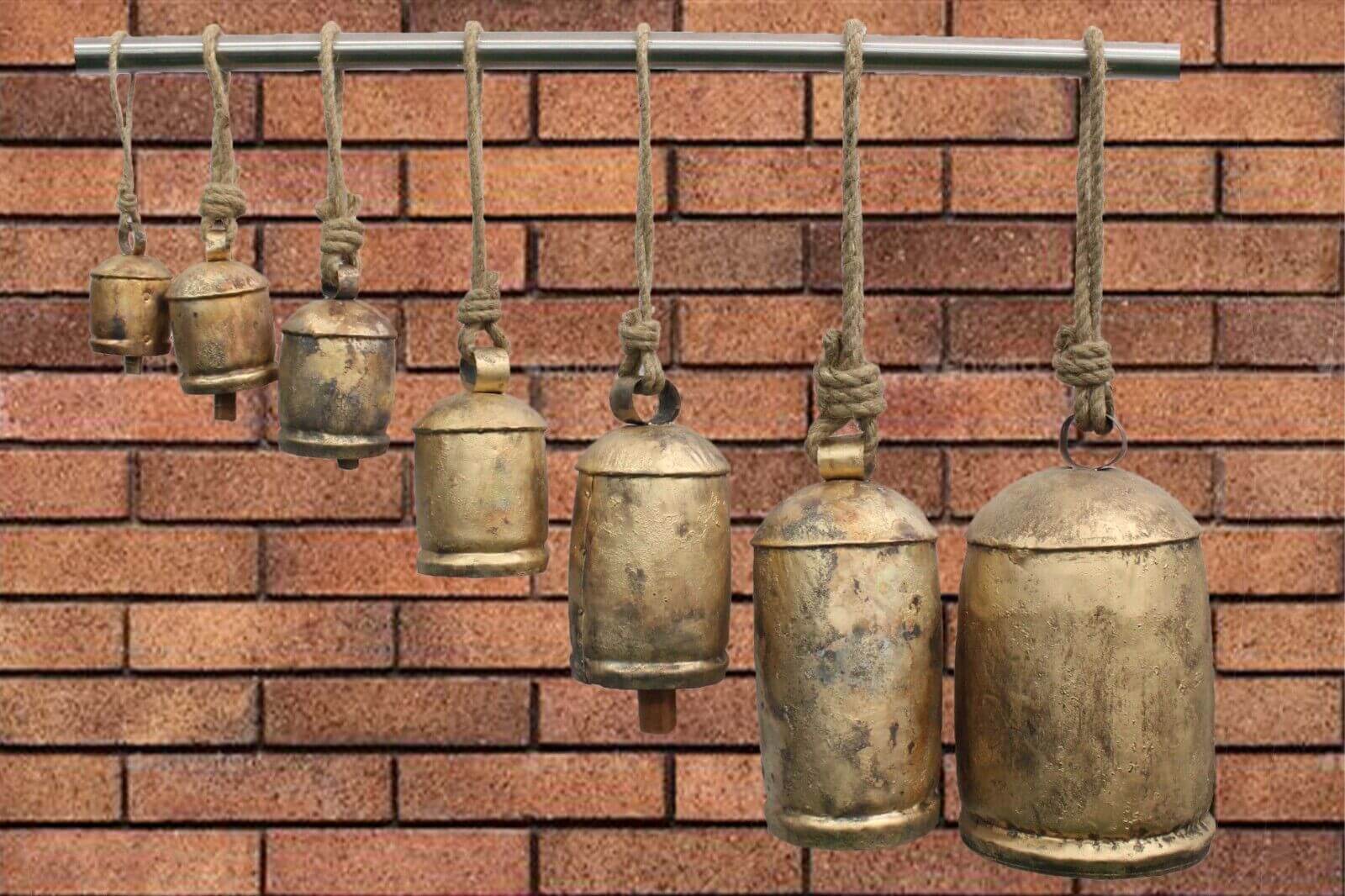 Enhance your space with these handcrafted antique finish cow bells. Perfect for garden decor, eco-friendly, and durable.