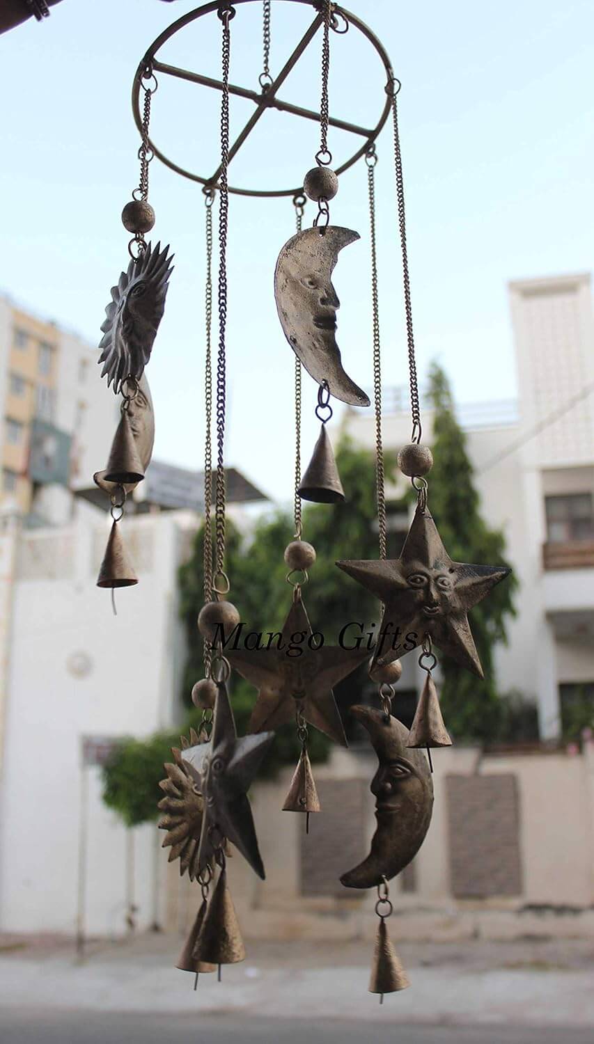 Antique look wind chime with sun and moon motifs, handcrafted for rustic garden décor, perfect for outdoors and indoors.