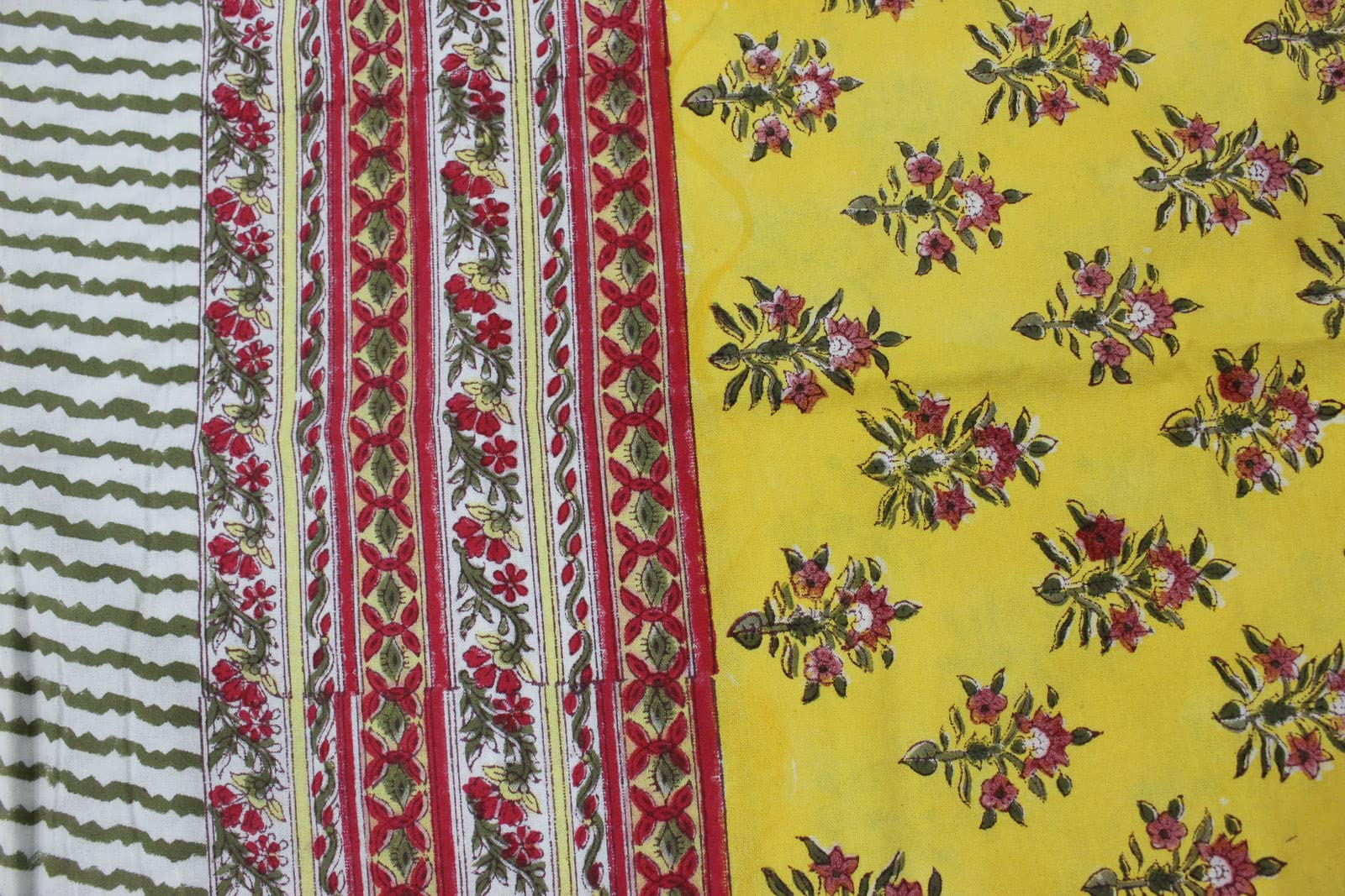 Vibrant yellow floral hand block print tablecloth with intricate red and green patterns, ideal for dining and parties.
