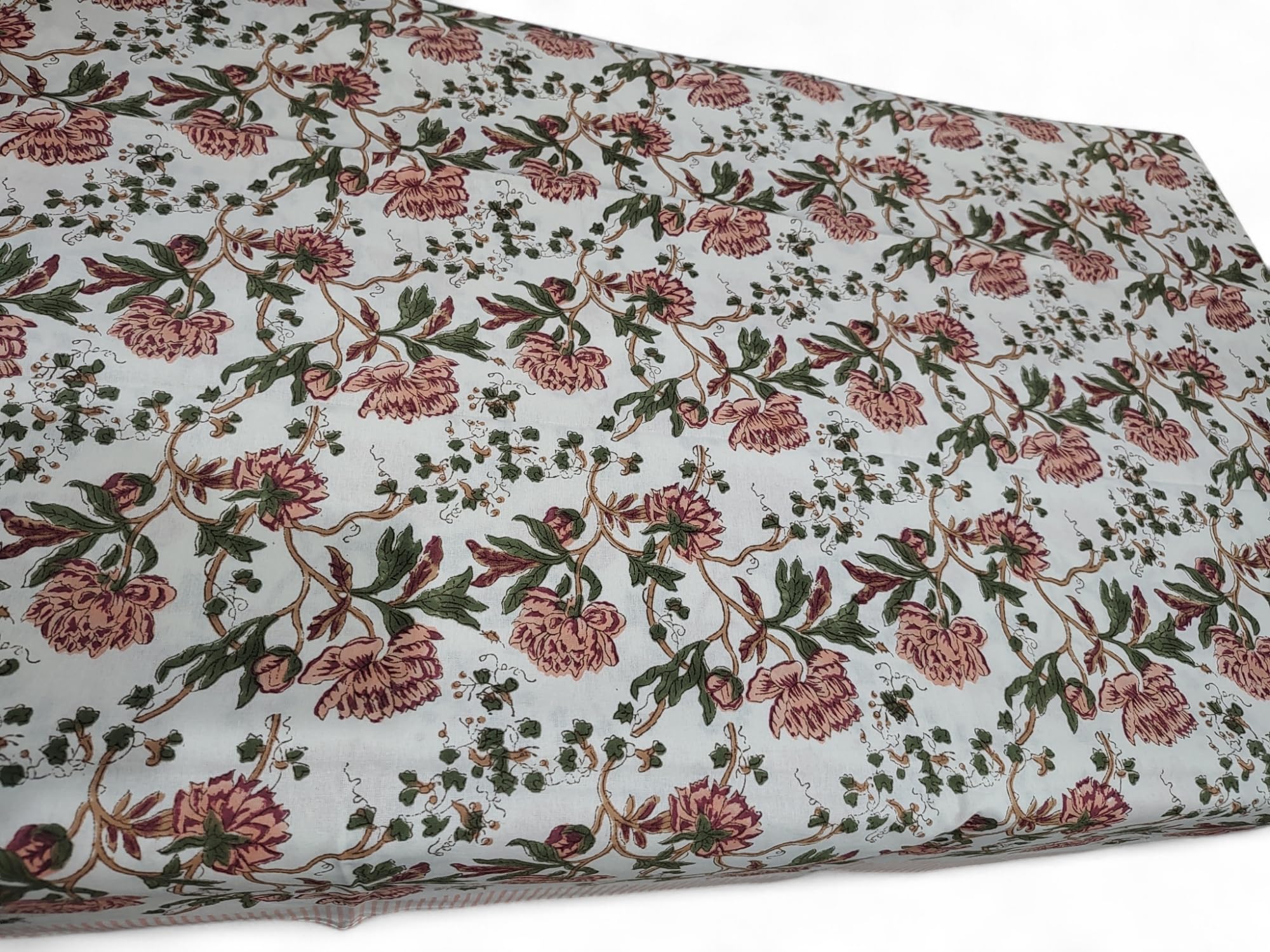 Beautiful white floral hand block print tablecloth, ideal for dining, weddings, and seasonal decor in versatile sizes.