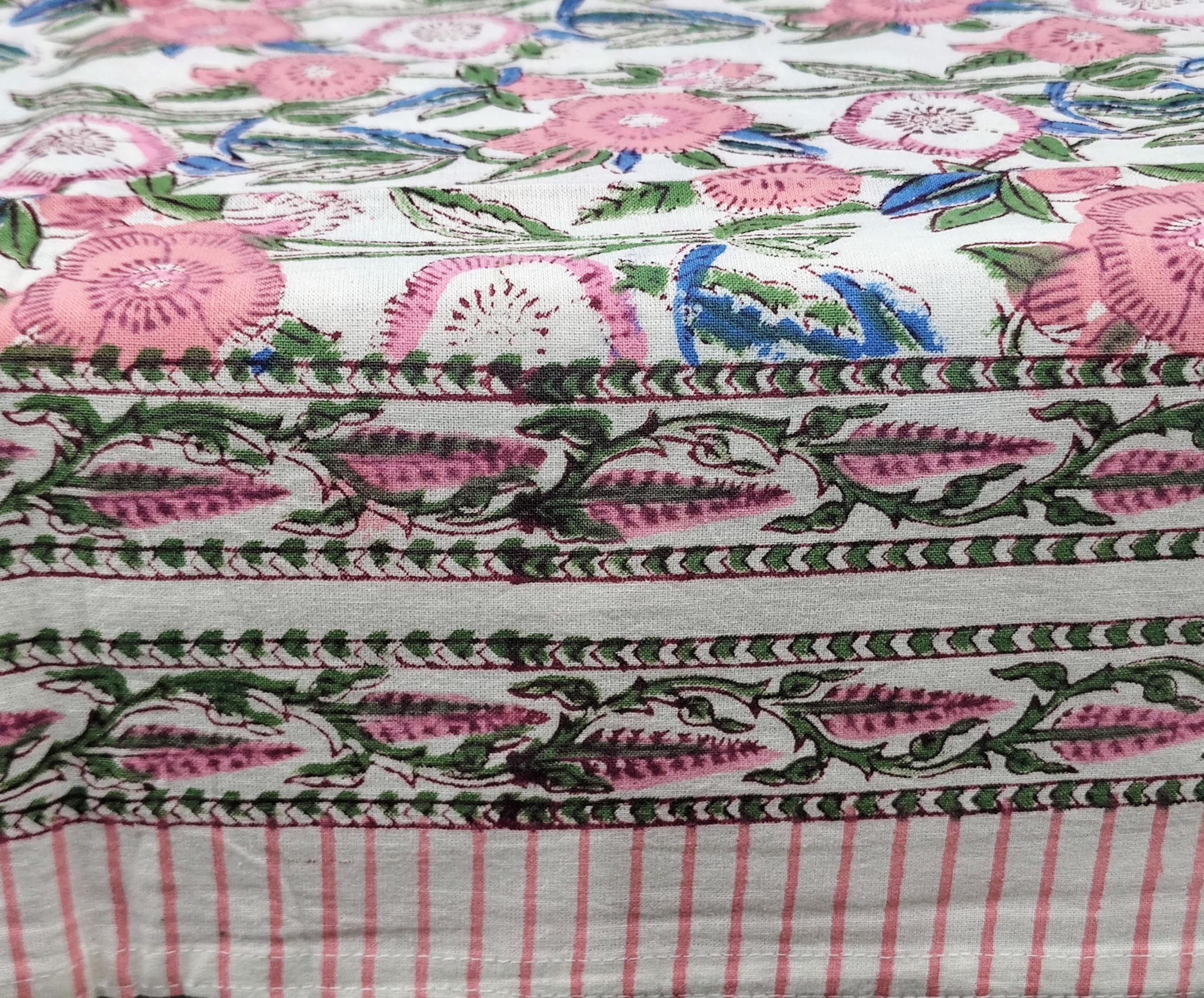White & pink floral hand block print tablecloth ideal for dining, weddings, and parties, adding elegance and charm.