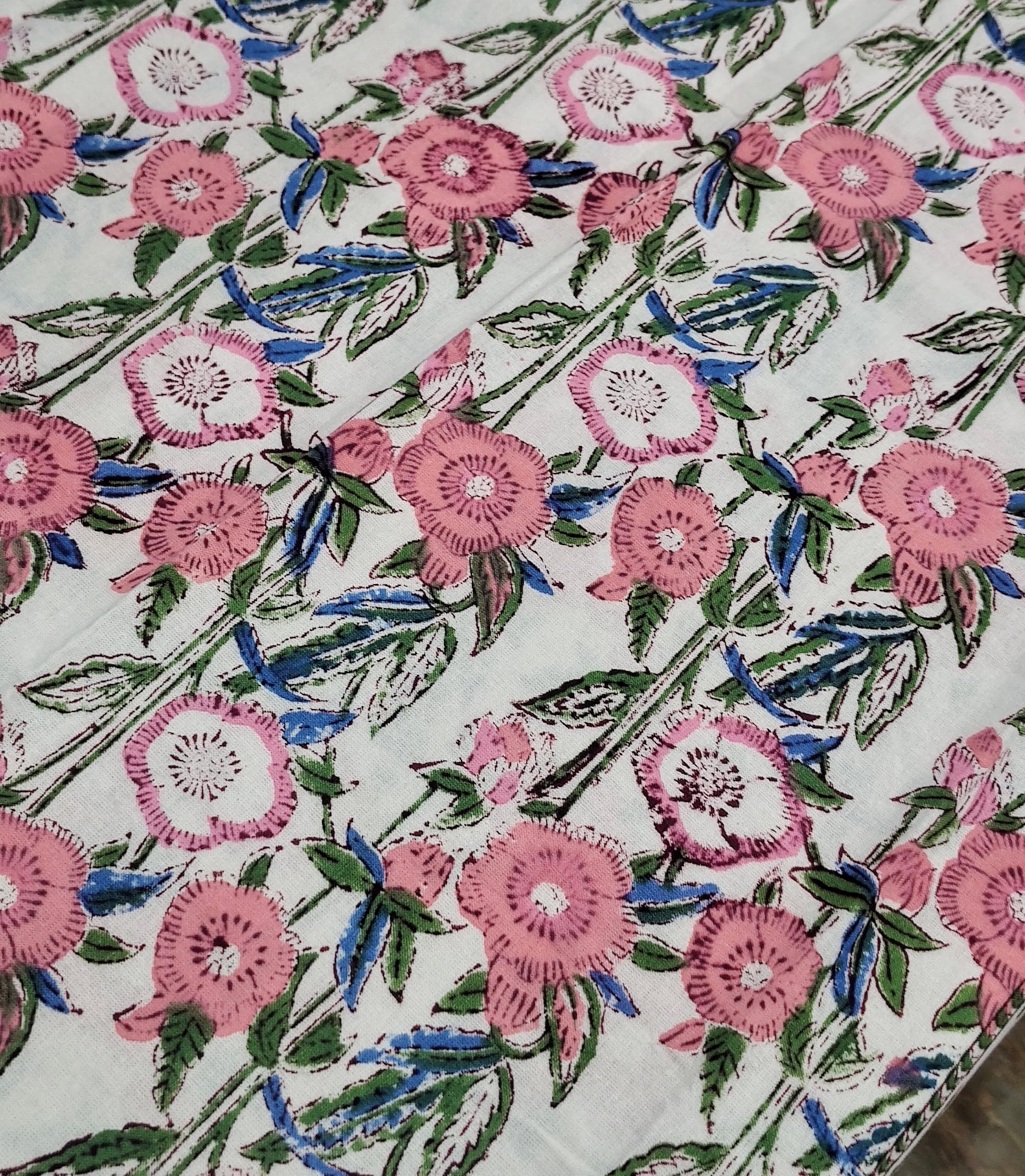 Elegant white and pink floral hand block print tablecloth with intricate flower design on cotton fabric.