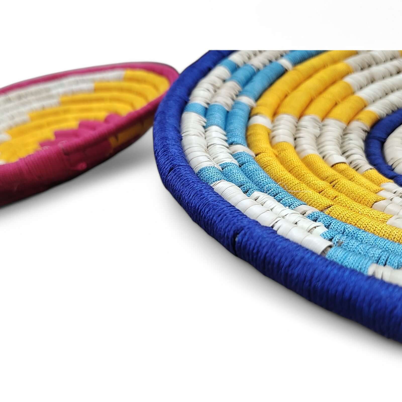 Close-up of colorful Sabai grass wall baskets showcasing vibrant patterns, perfect for boho decor and wall art.