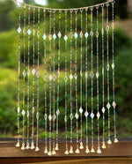 Colorful Bohemian curtain with glass beads and metal bells for doorways and wall decor, 40 inches long.