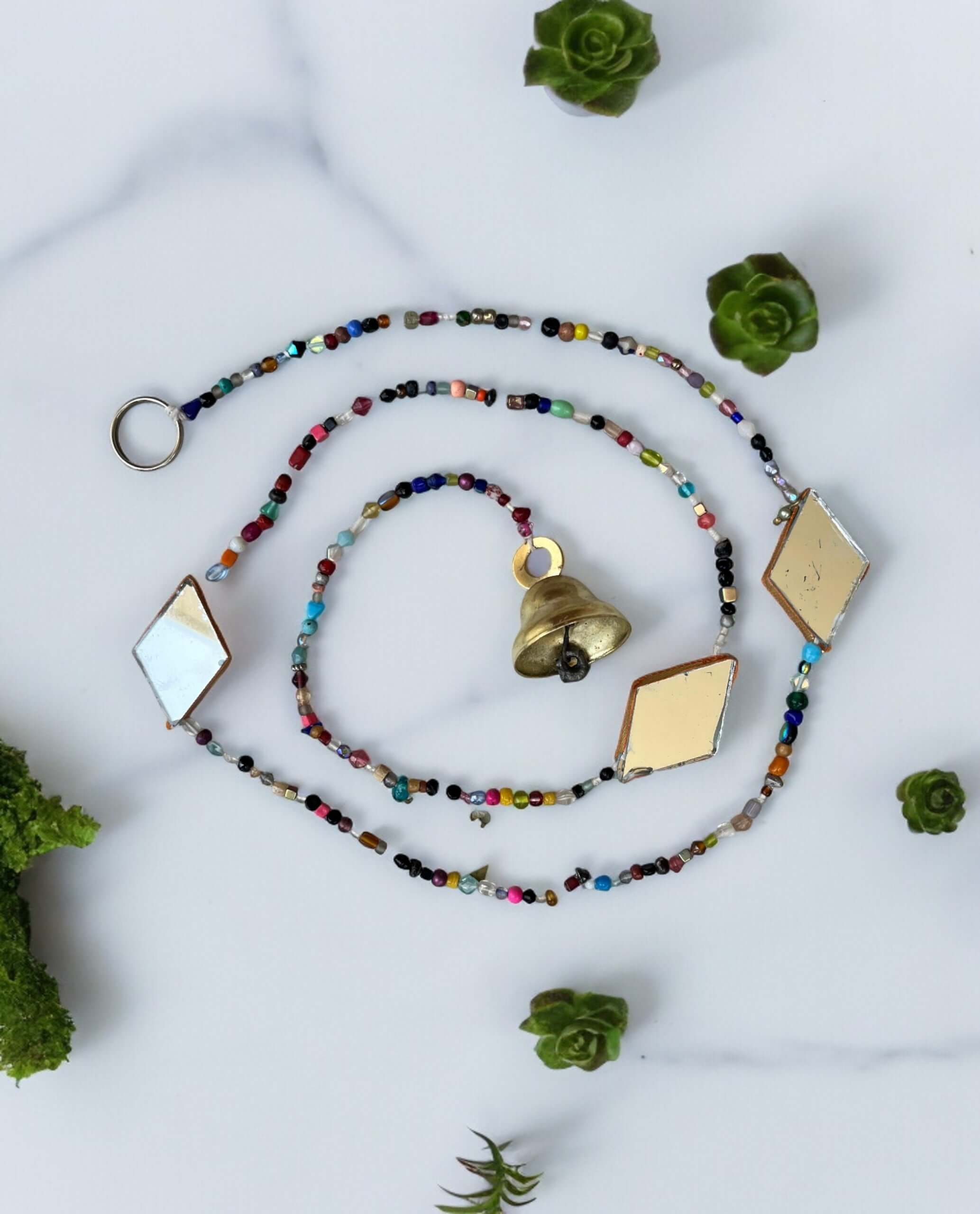 Colorful beaded curtain chain with glass beads and jingle bell, perfect for hippie home décor and doorway decoration.