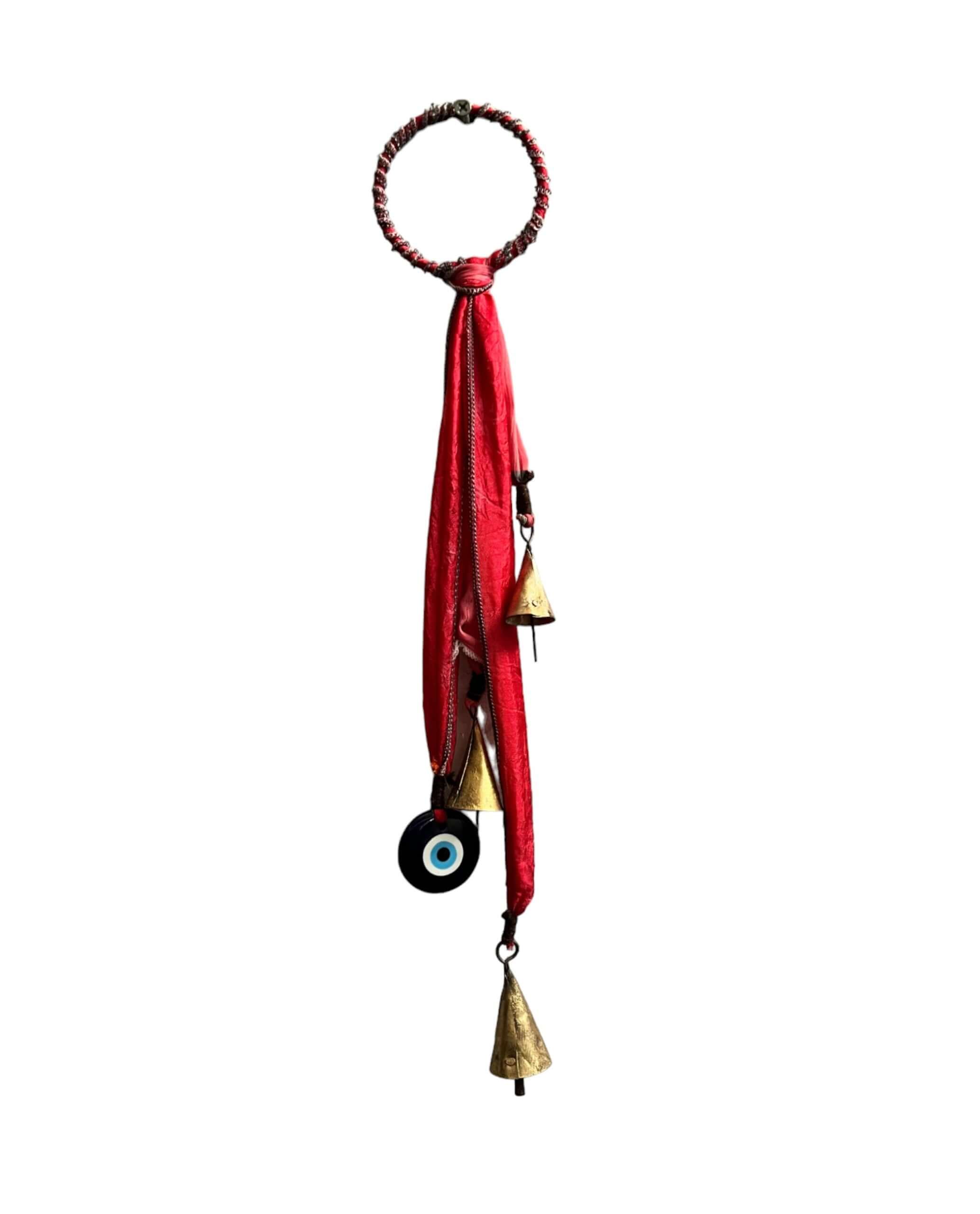 Handmade Evil Eye metal bell door hanger, bohemian holiday decor with recycled materials and tinkling sound.