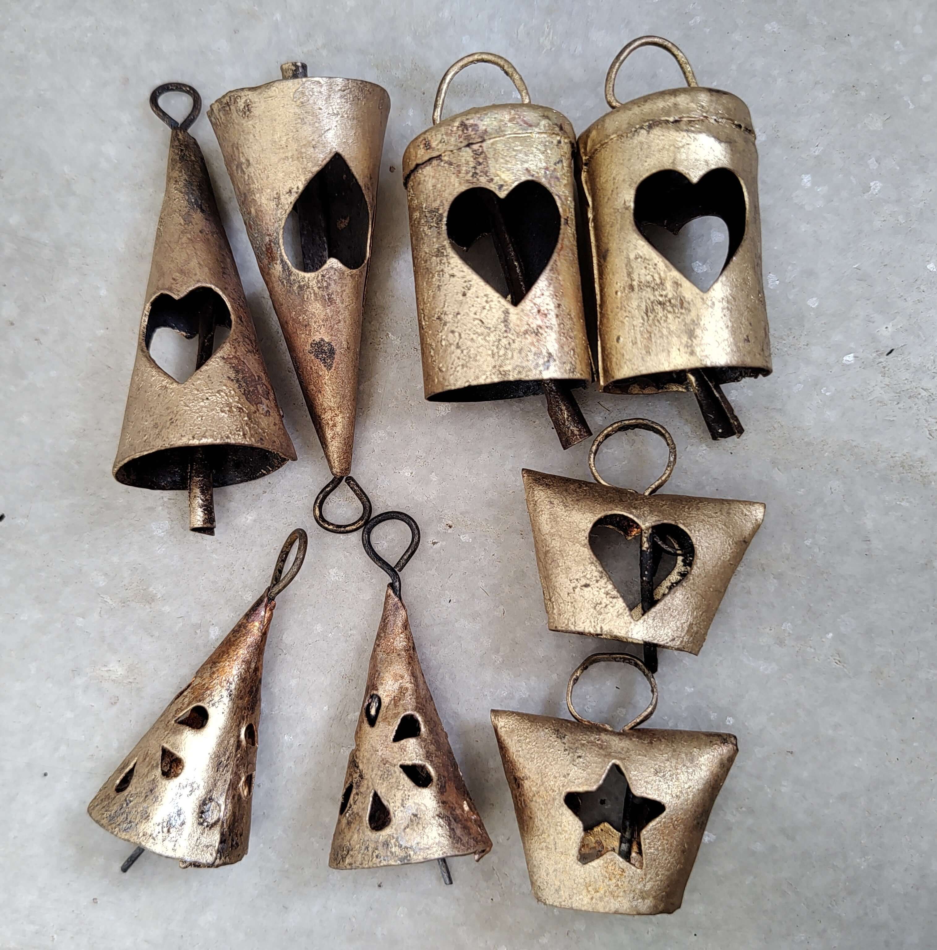 Indian Metal Craft Cow Bells - Vintage iron tin bells set with heart and star cutouts.