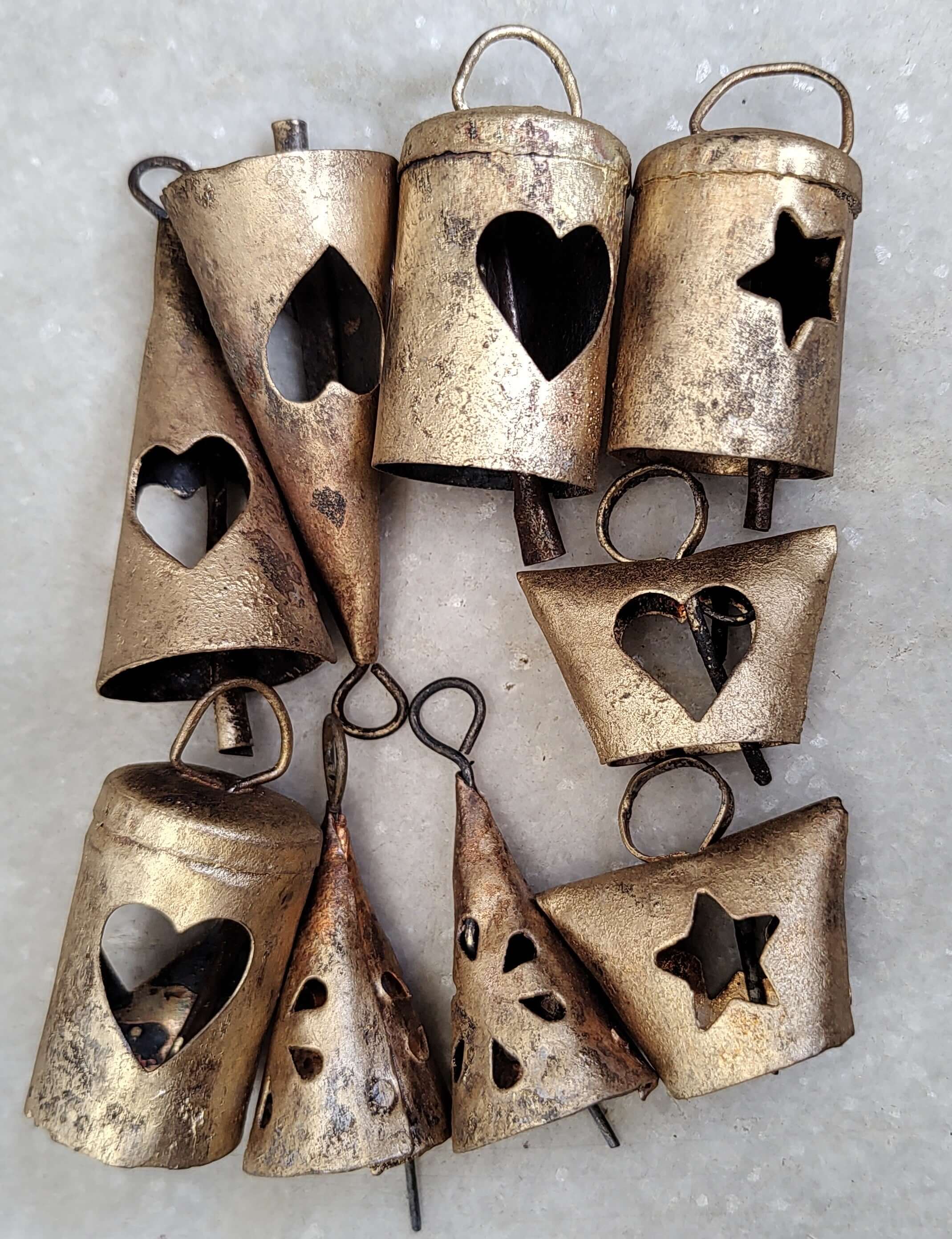 Indian Metal Craft Cow Bells vintage recycled iron tin set with heart and star cutouts.
