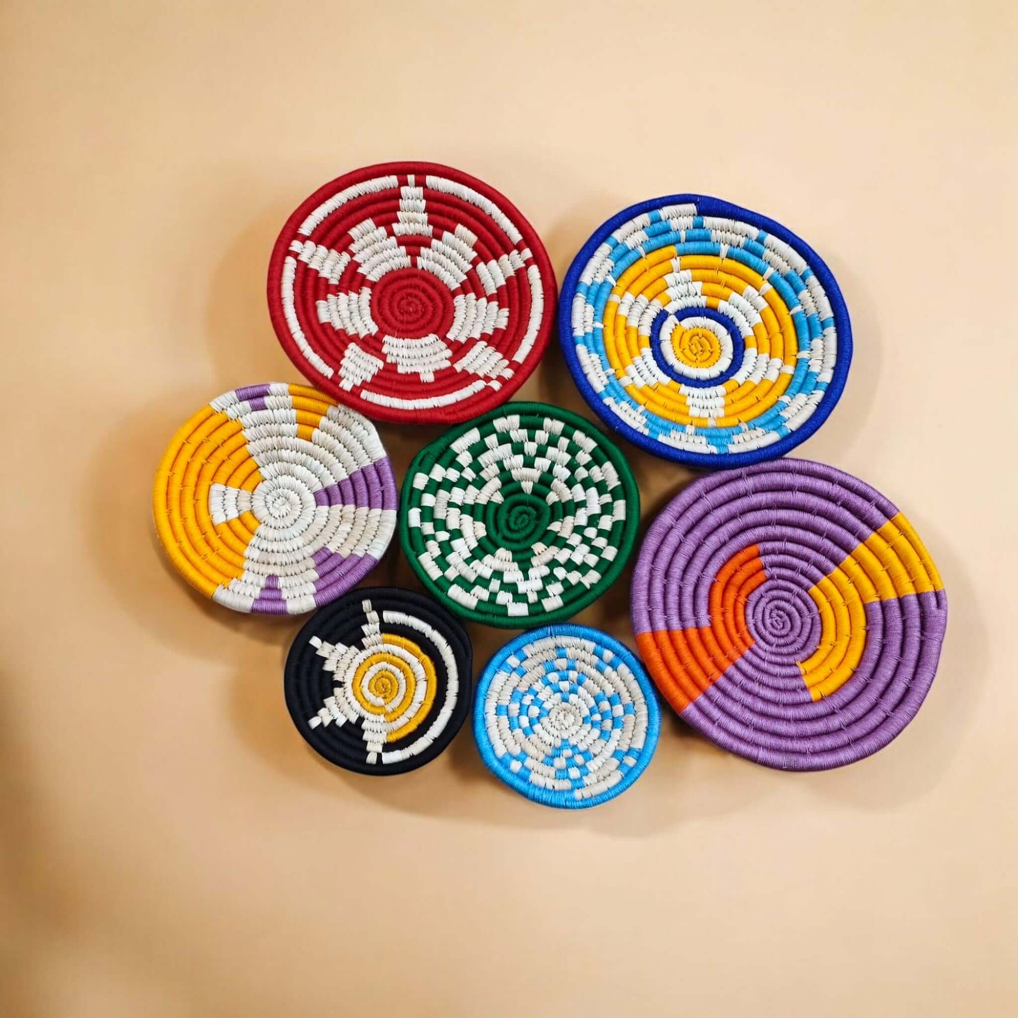 Colorful handwoven rattan wall baskets set of 7, perfect for boho home décor and sustainable artisan charm.