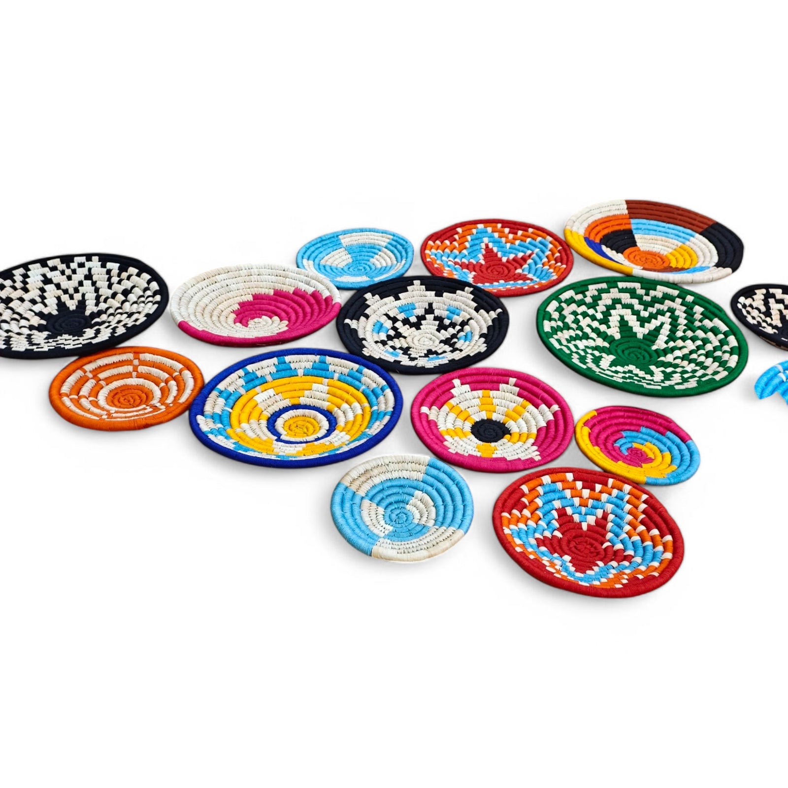 Colorful handmade Sabai grass wall plates for boho decor, featuring vibrant patterns and eco-friendly design.