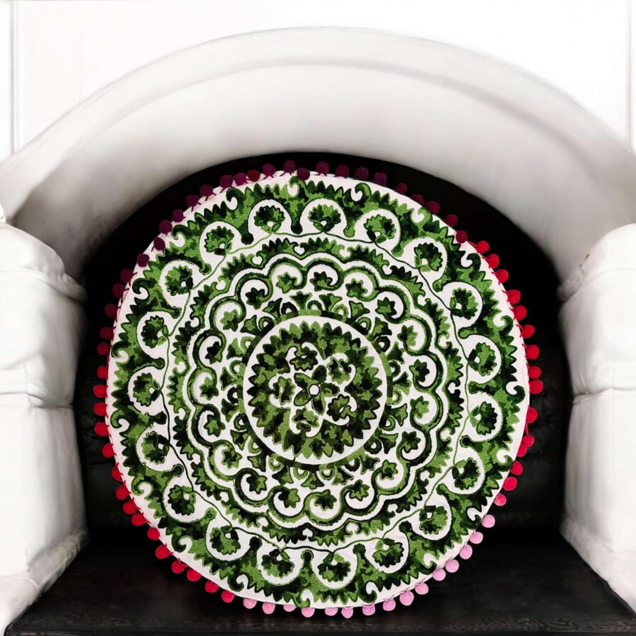 Multicolor Round Floral Paisley Printed Cushion Covers featuring intricate design and pom-pom accents on a round throw pillow.