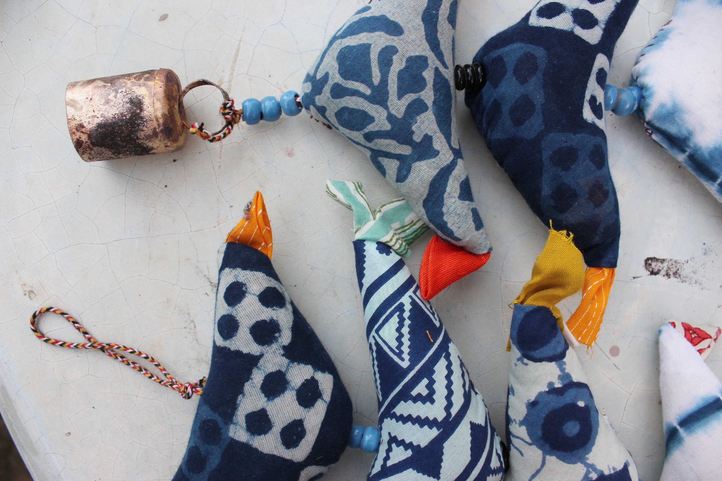 Handmade eco-friendly bird bells in indigo, perfect for unique décor. 100 cm height string with metal bells. Ideal gift for you!