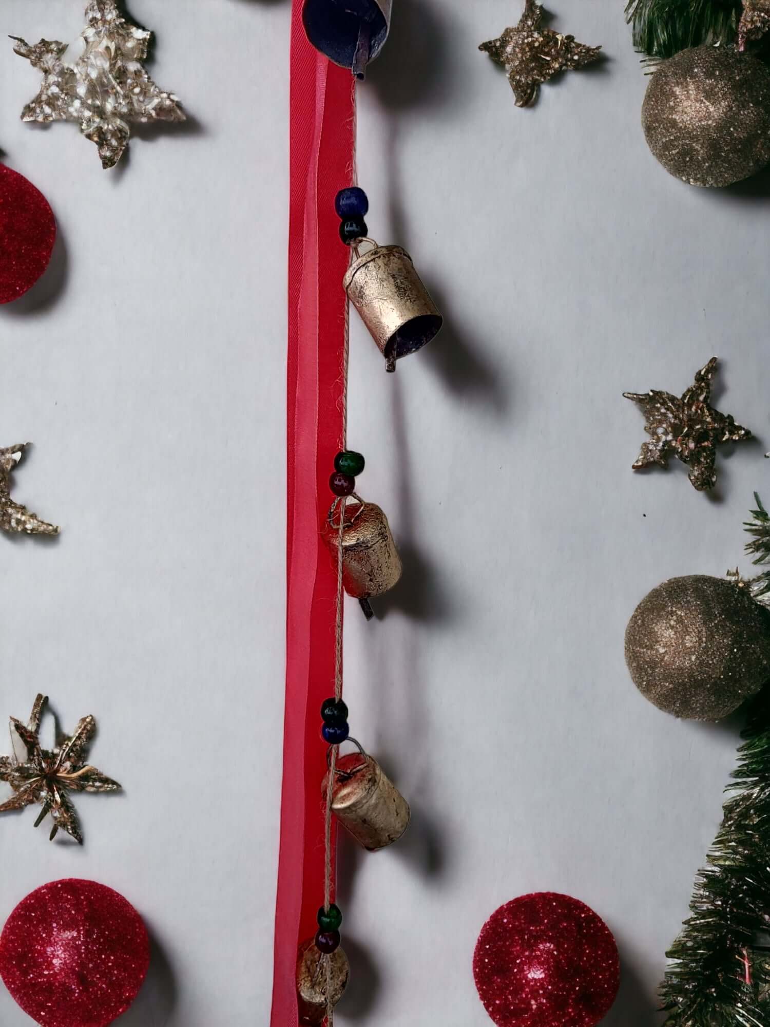 Metal Wall Hanging Bells Vintage Indian Style Set of 10 displayed with festive decorations and colorful ornaments.