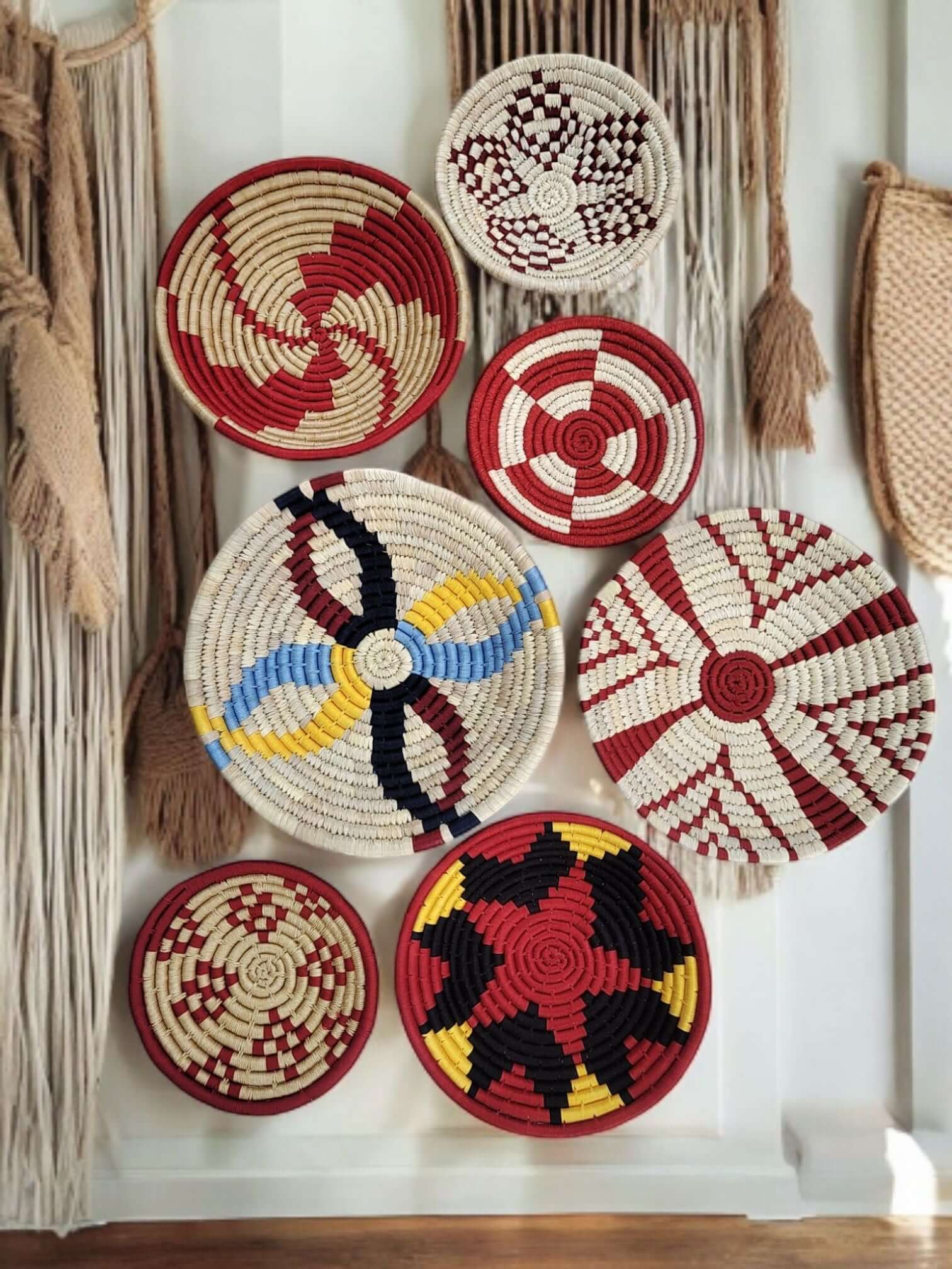 Colorful handwoven Sabai grass wall baskets in bohemian style, perfect for eco-friendly home decor.