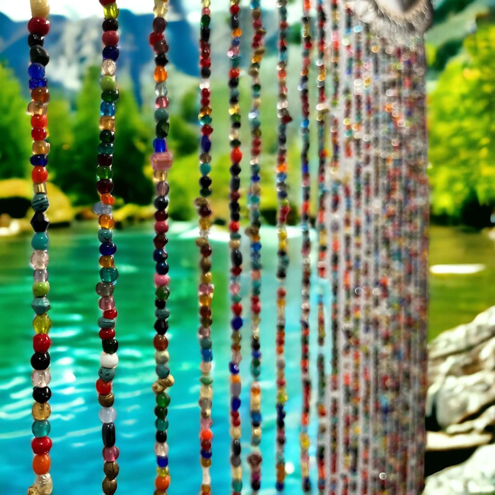 Colorful handmade beaded curtain strands with jingle bells, perfect for boho home décor and doorway dividers.