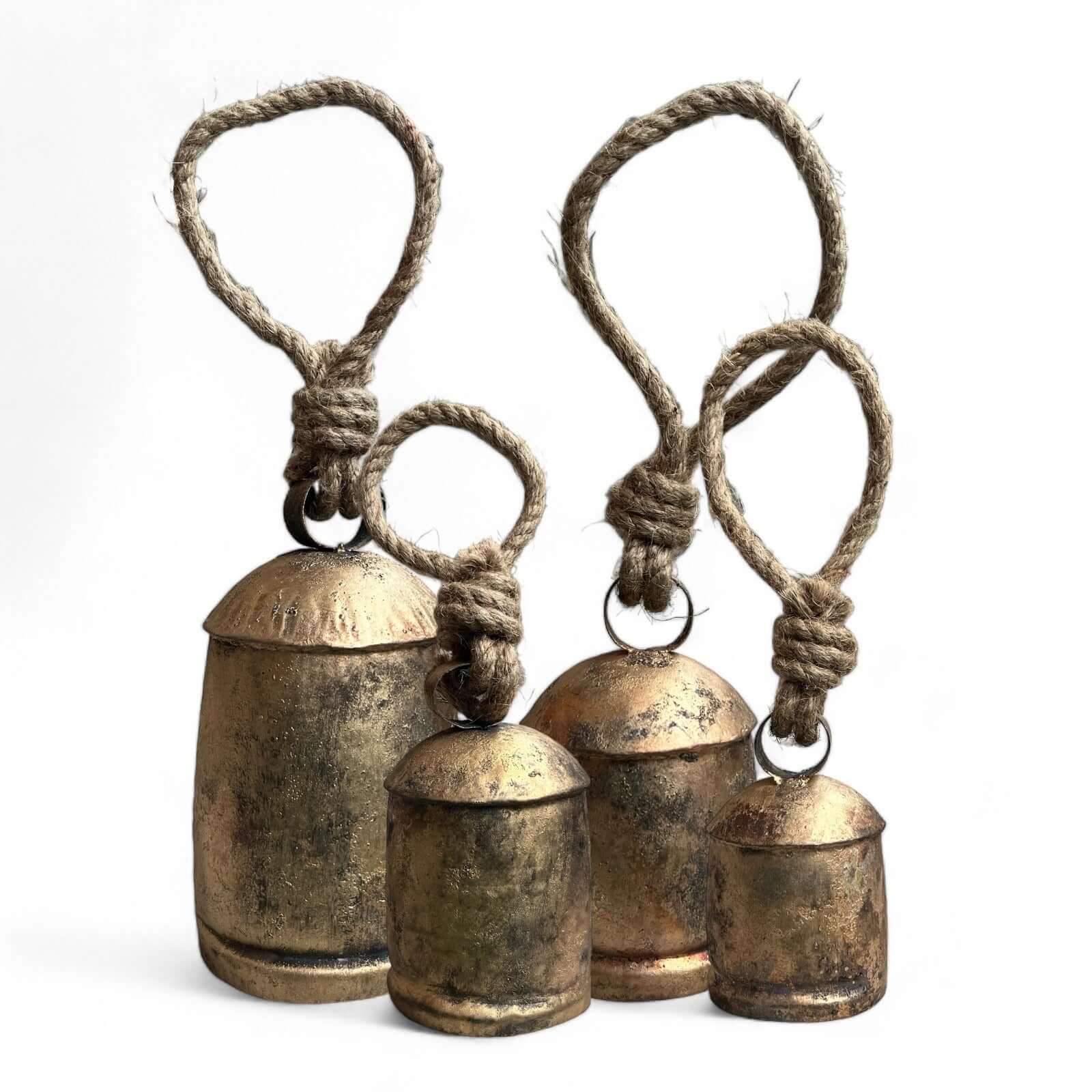 Set of 5 vintage handmade rustic cow bells with jute rope hangers in antique gold finish, ideal for garden decor.