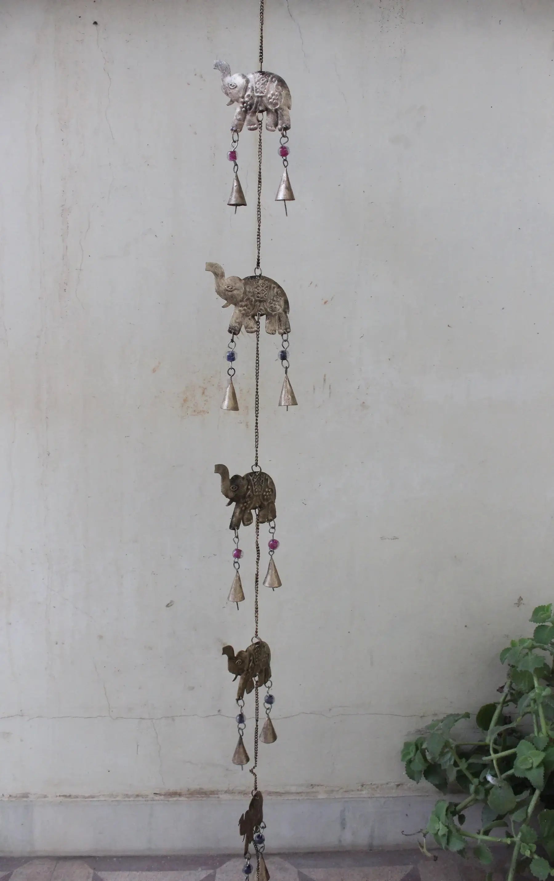 Handmade elephant wind chime wall hanging with five bells for outdoor decor, 52 inches long, crafted from recycled iron.
