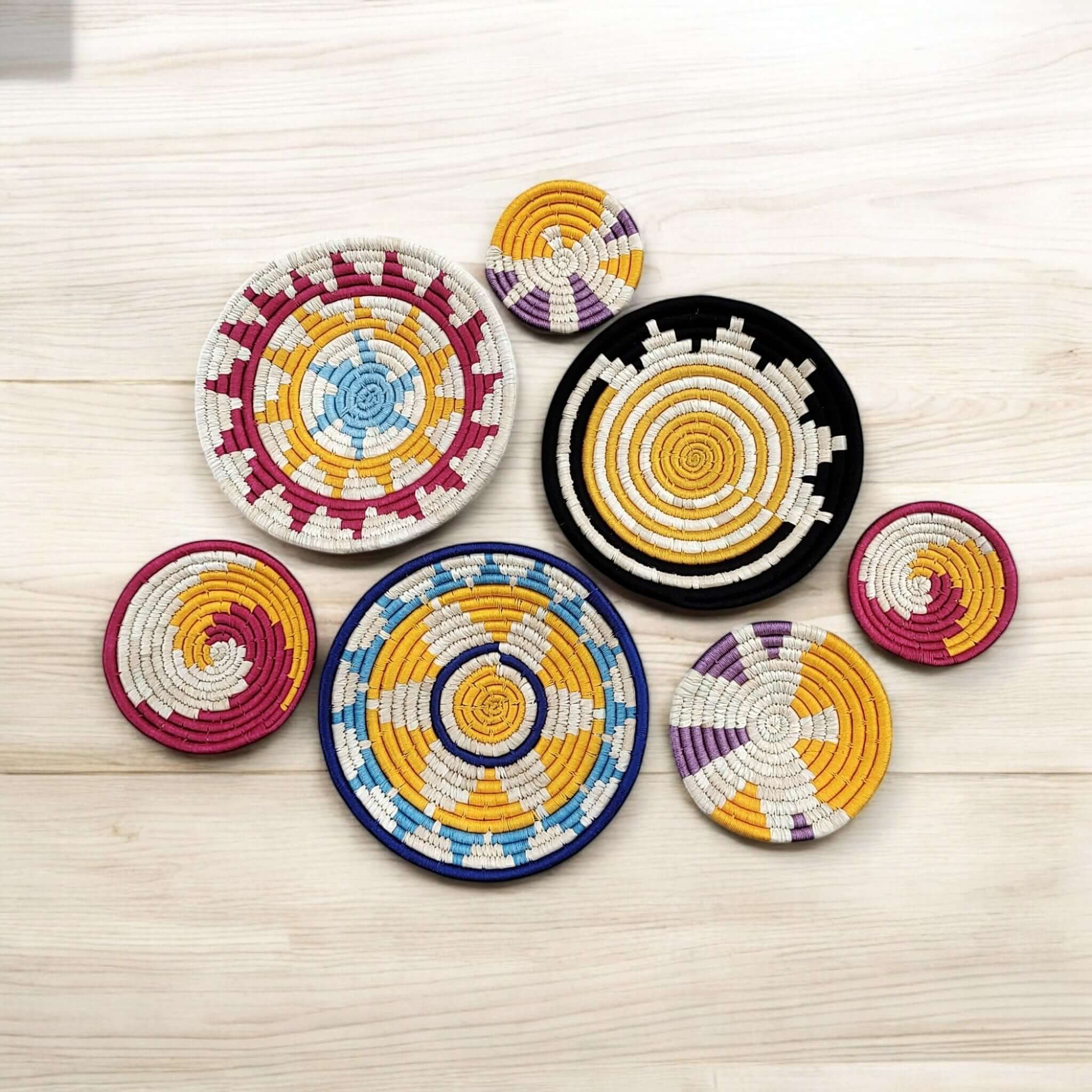 Handwoven multicolor rattan wall baskets, eco-friendly bohemian decor, set of 7 for stylish home display.