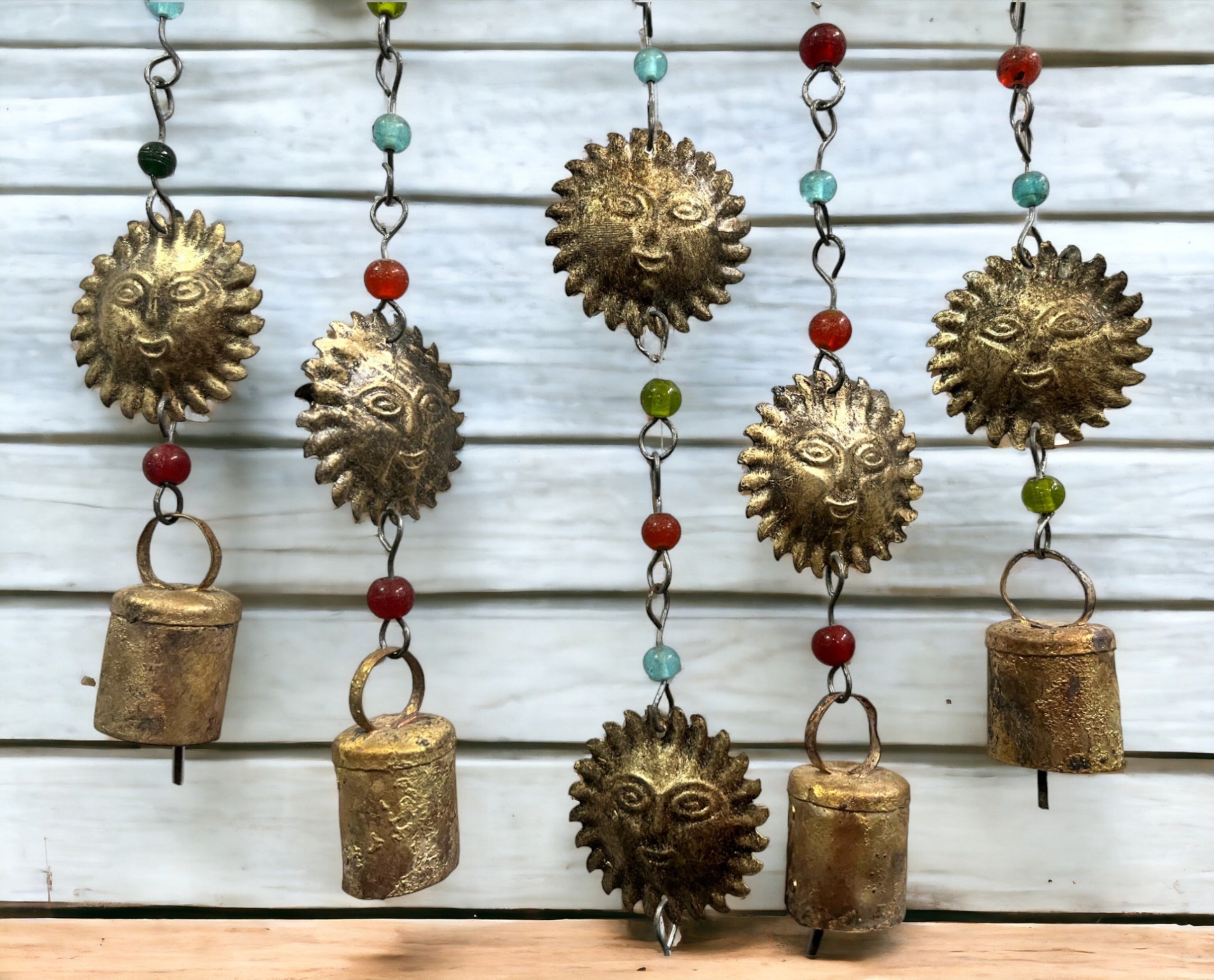 Handmade beaded iron windchime with sun and bell designs, perfect for boho decor and all occasions.