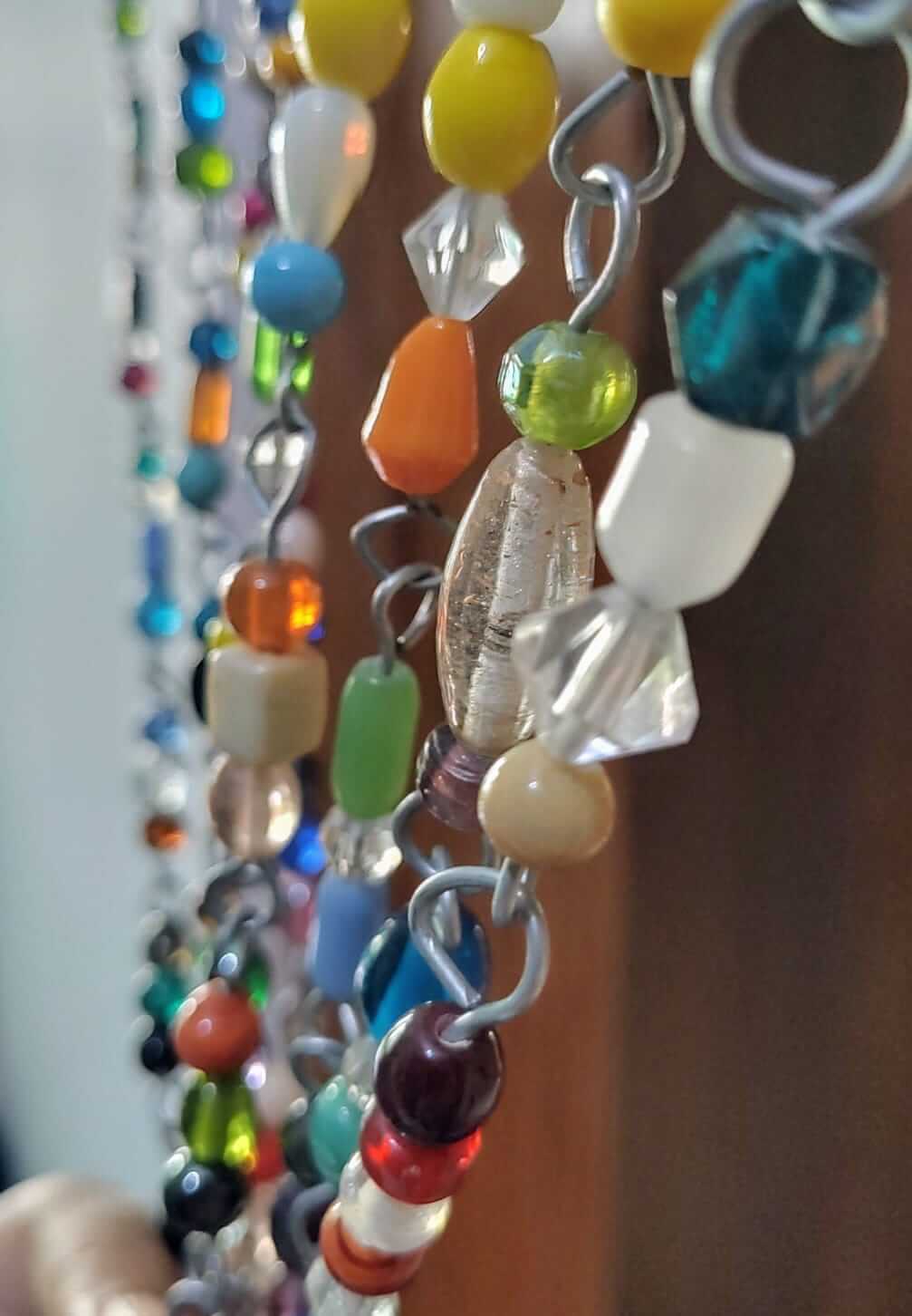 Colorful strands of glass beads for bohemian beaded curtains, ideal for doorways and sun catchers.