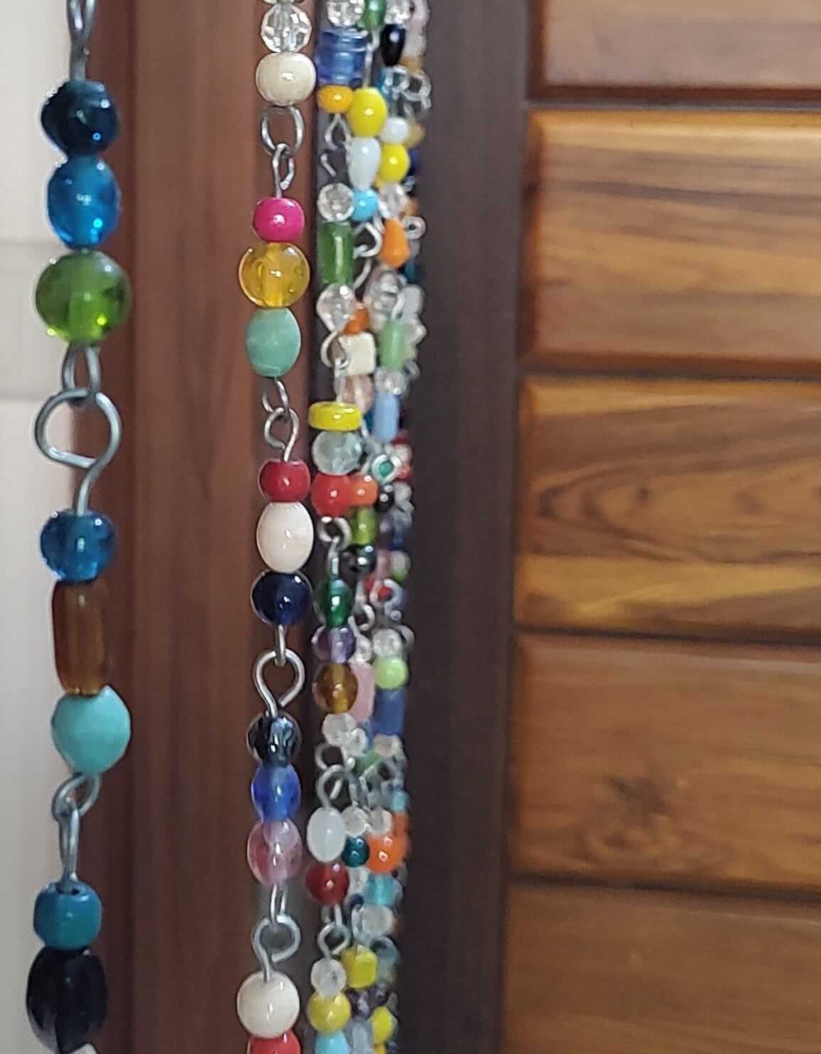 Colorful strands of glass beads for a beaded curtain, perfect as hippie door beads or boho decor.