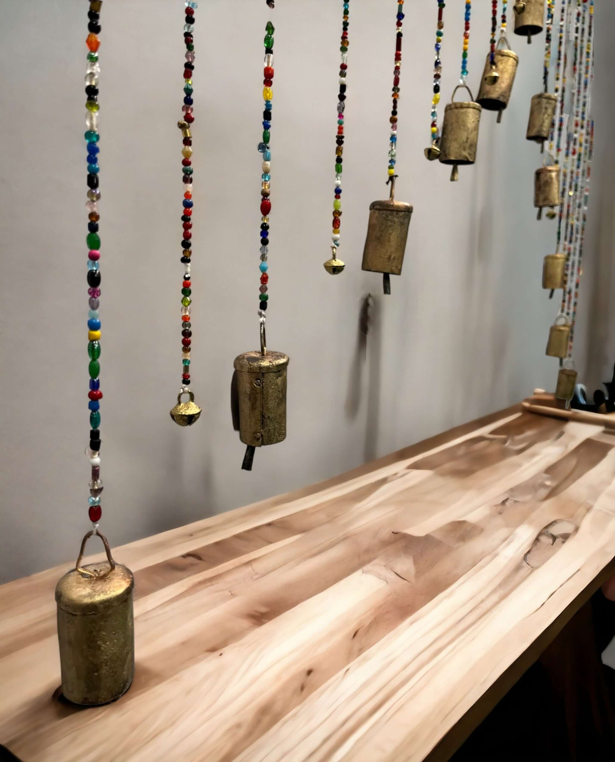 Handmade beaded wall door hanging with colorful glass beads and brass bells, perfect for Bohemian home décor.