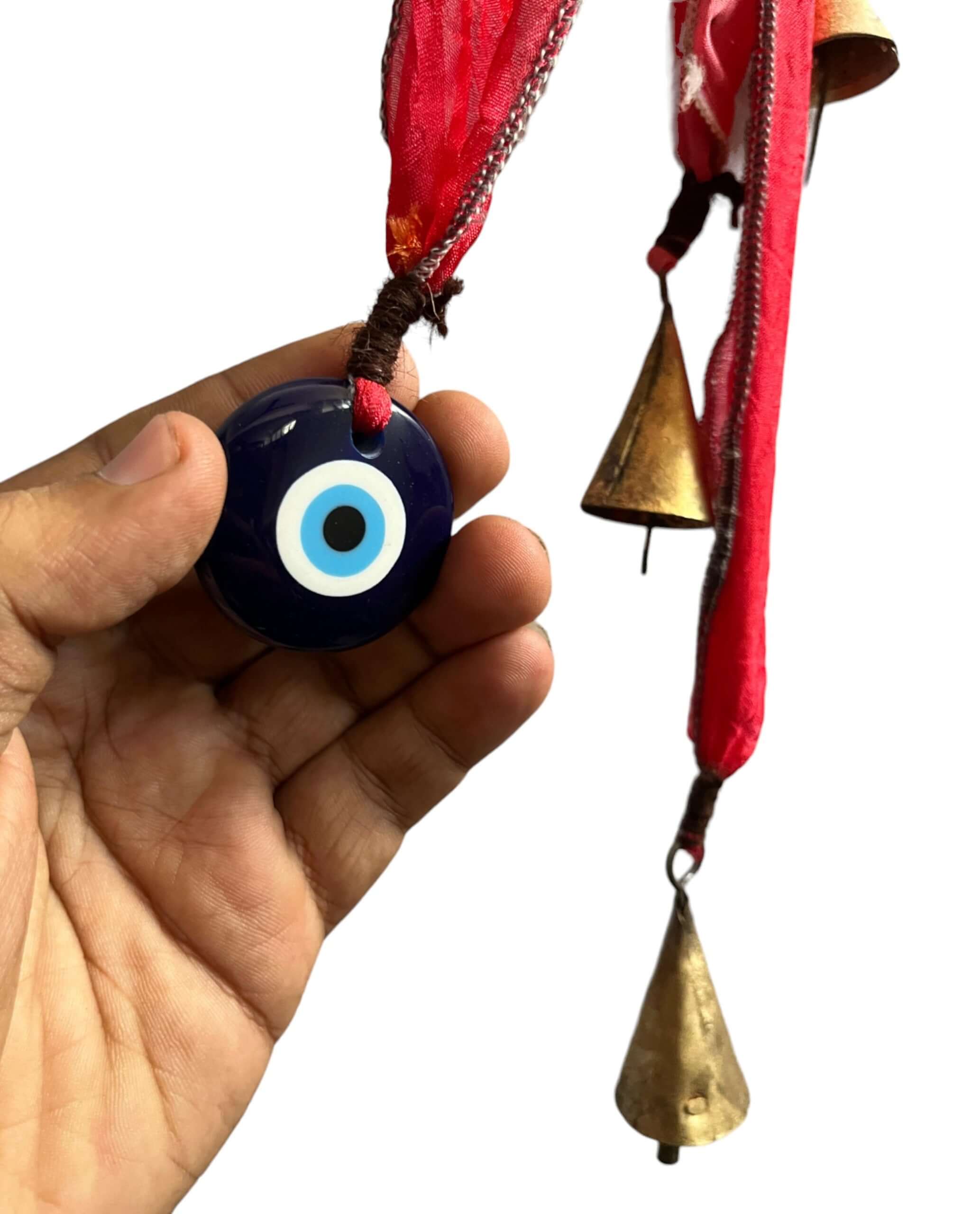 Handmade Evil Eye metal bell ornament with vibrant sari ribbons, perfect for Christmas and holiday decor. Recycled materials used.