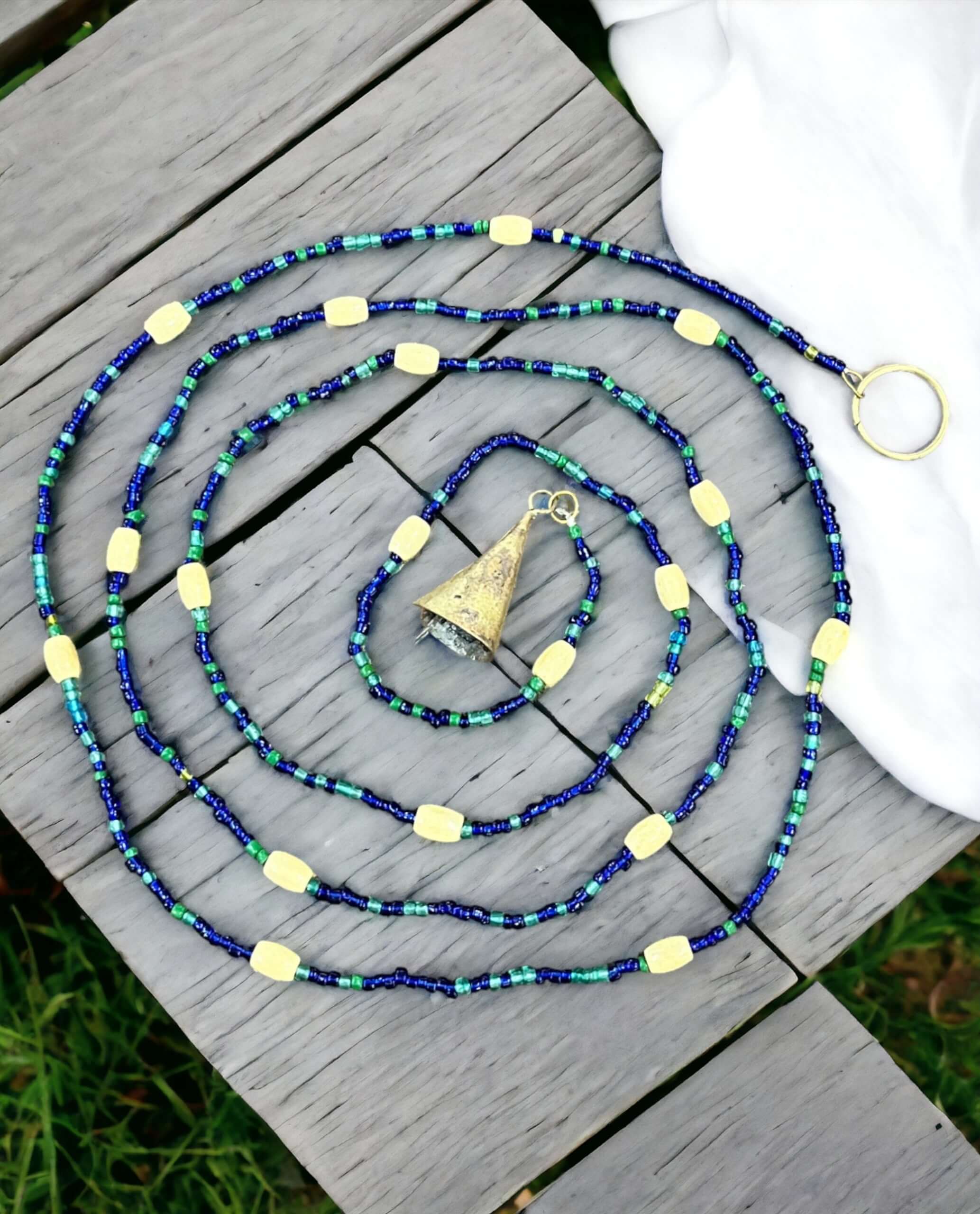 Handmade colorful glass bead strands with jingle bells—perfect for doorways or wall décor. Eco-friendly and crafted by women's artisans in India.