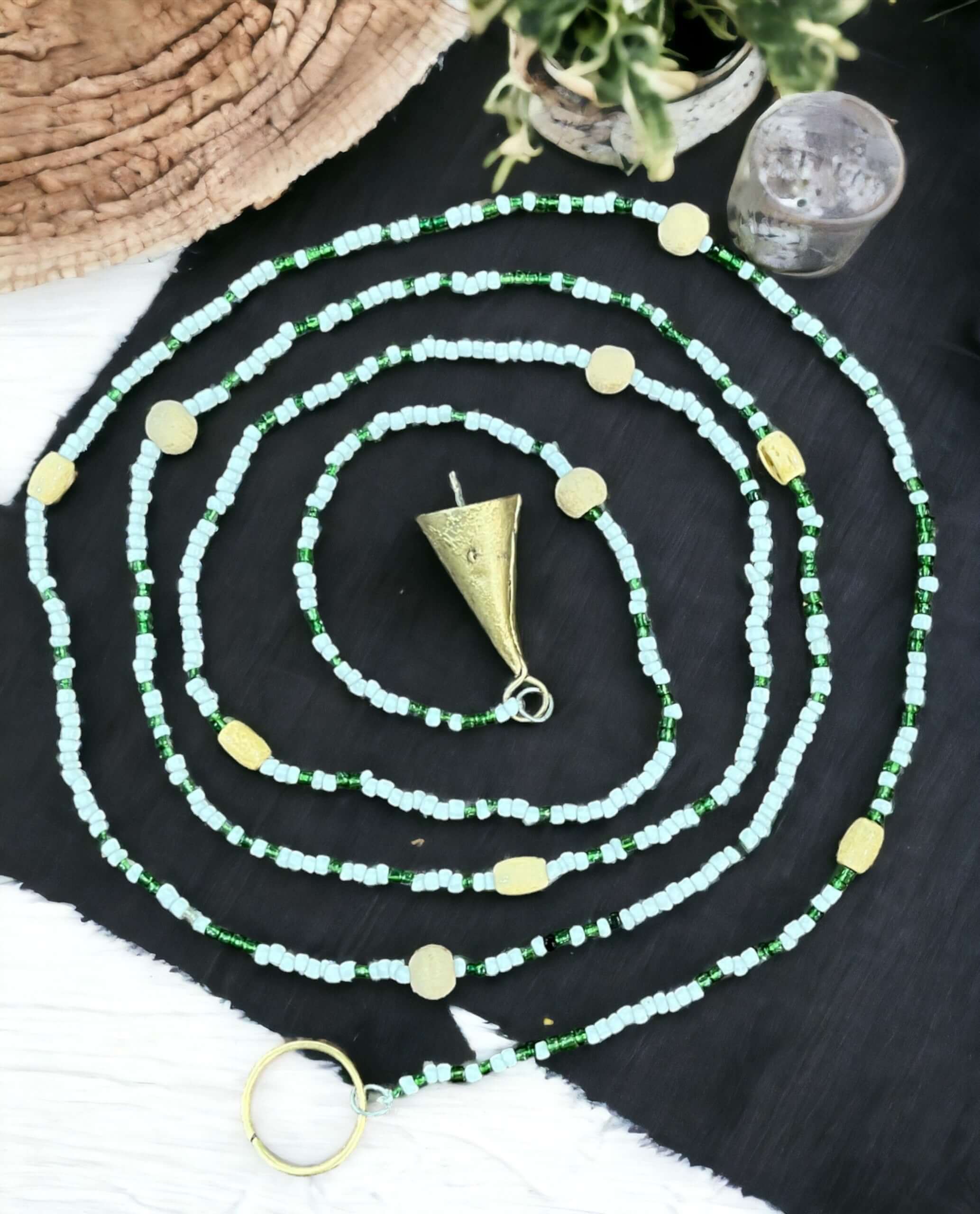 Handmade colorful glass bead strands with jingle bells—perfect for doorways or wall décor. Eco-friendly and crafted by women's artisans in India.