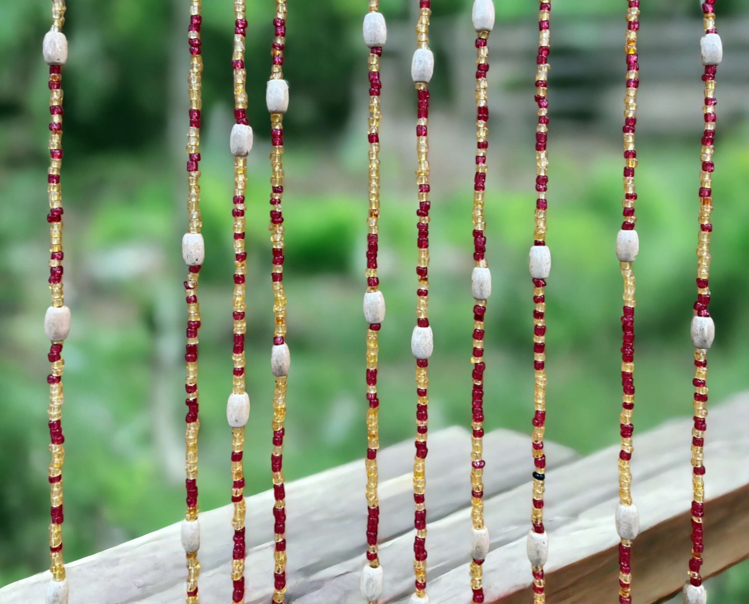 Handmade colorful glass bead strands with jingle bells—perfect for doorways or wall décor. Eco-friendly and crafted by women's artisans in India.