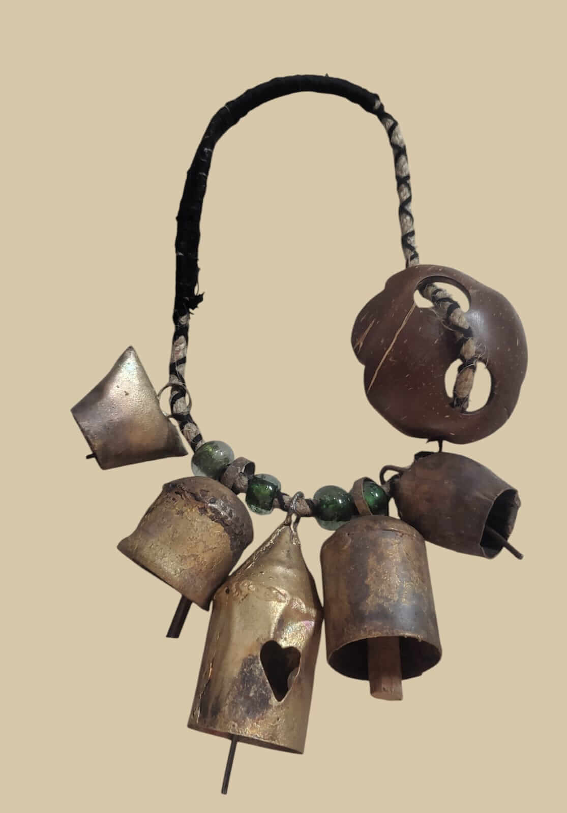 Rustic Christmas bells necklace with assorted metal bells and green beads for holiday decor.