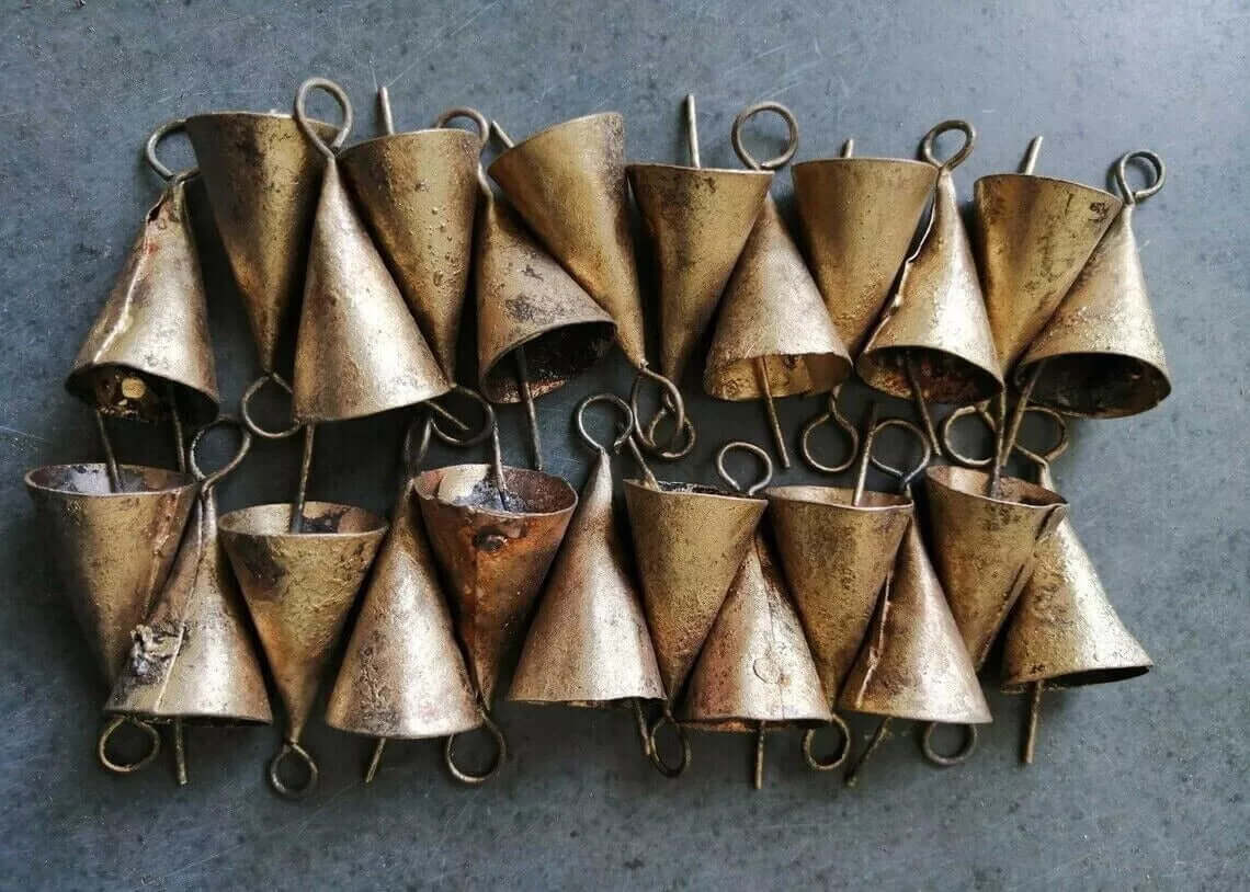 Rustic cone-shaped recycled iron bells, handmade in India, featuring a golden brass finish, perfect for crafts and decorations.