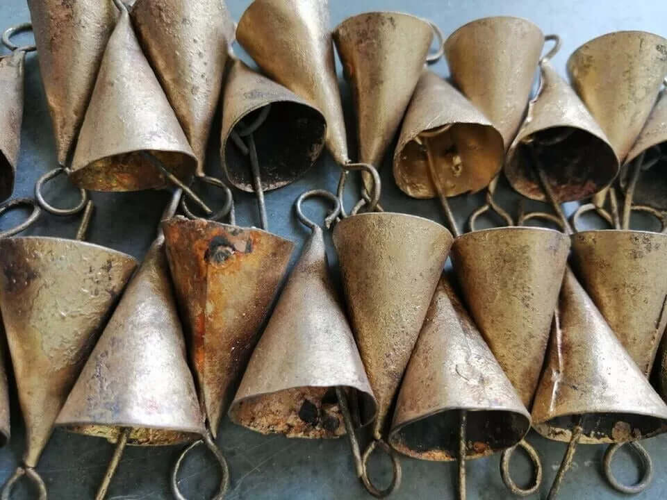 Handmade recycled iron rustic cone shape bells, 1.75 inches, with brass coating, perfect for crafts and decor.