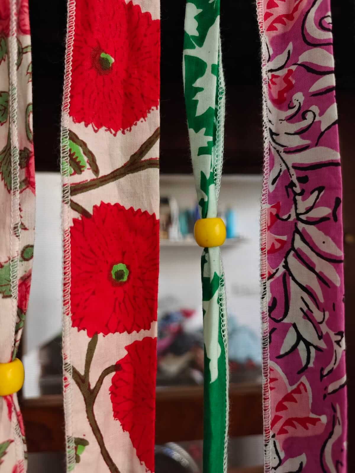 Bohemian Hippy Beaded Doorway Garland featuring colorful floral fabric ribbons with decorative beads.