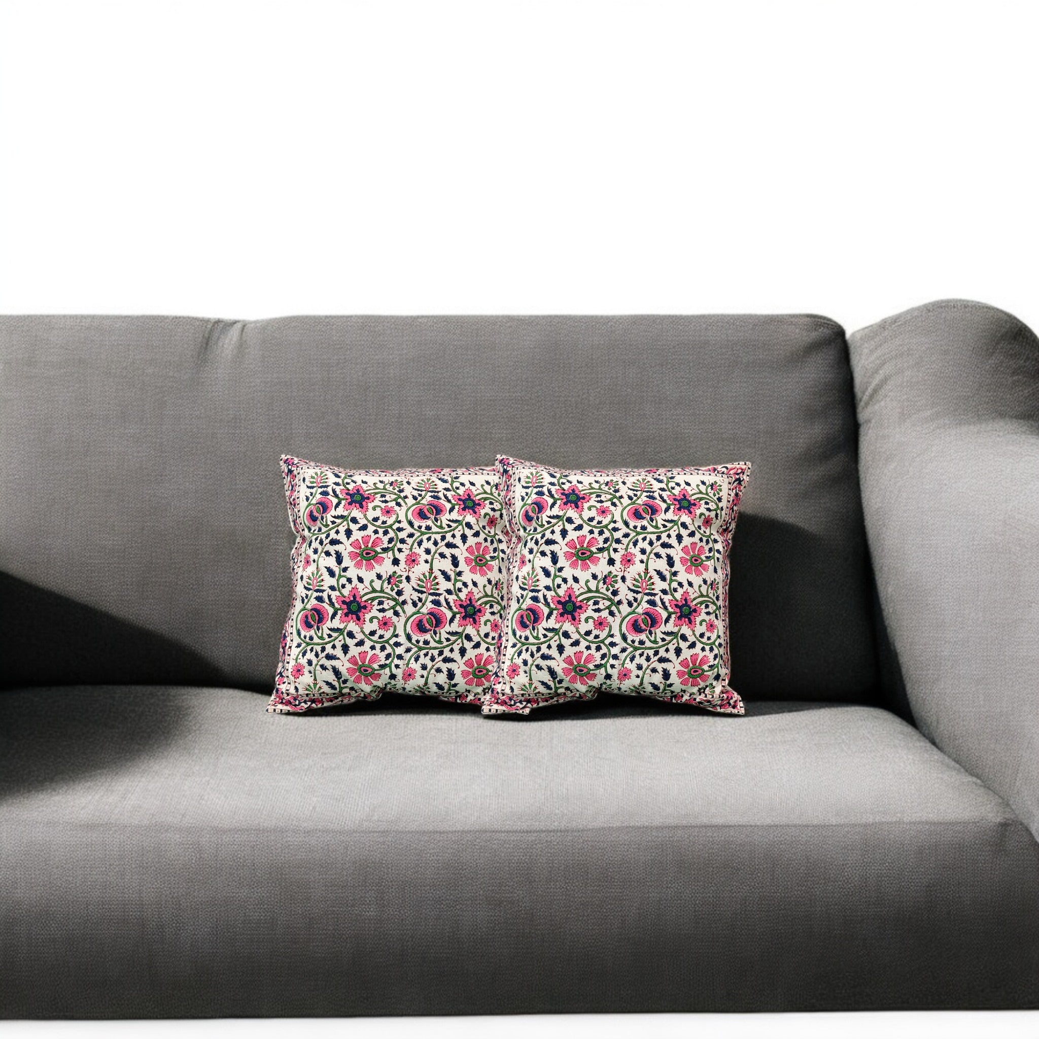 Set of 2 floral embroidered cushion covers on a gray sofa, perfect for adding a touch of elegance to your living space.