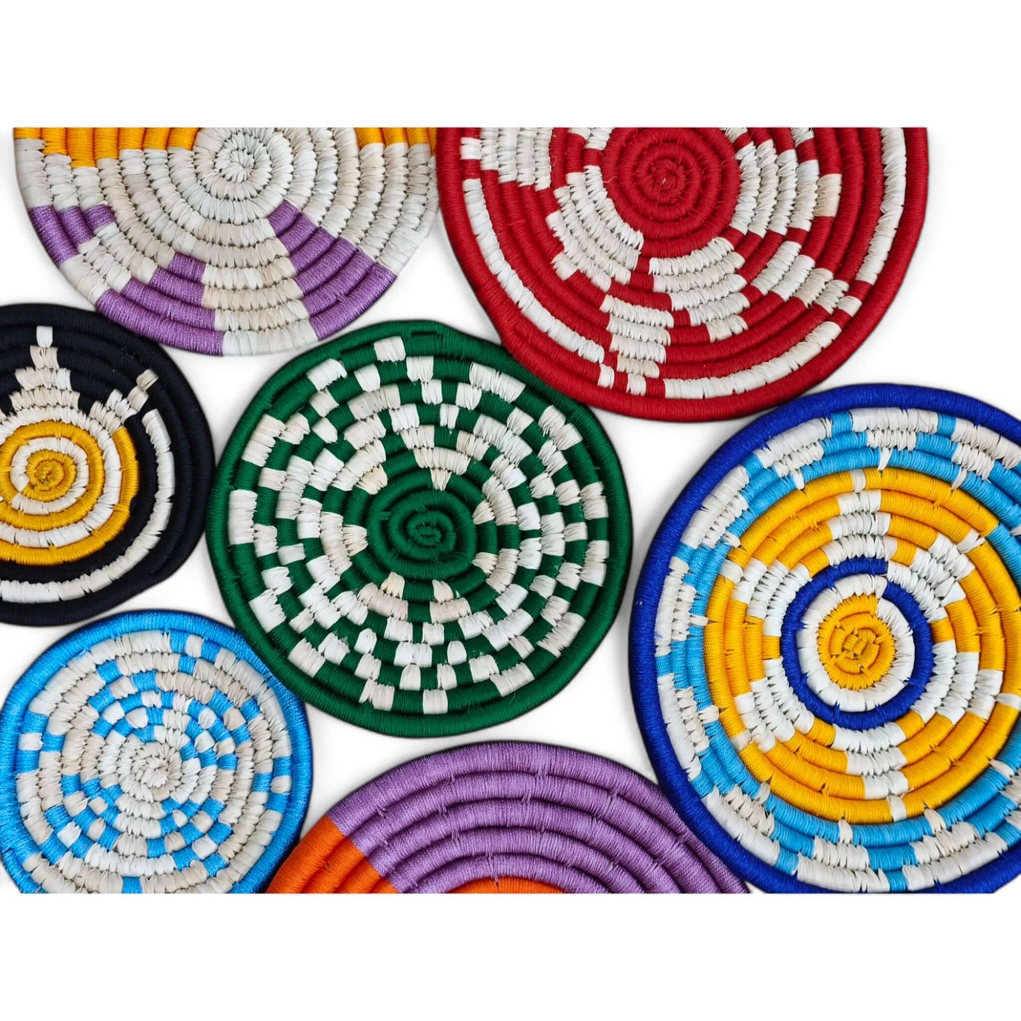 Colorful handwoven Sabai grass wall baskets in various patterns, perfect for bohemian wall decor and indoor accents.