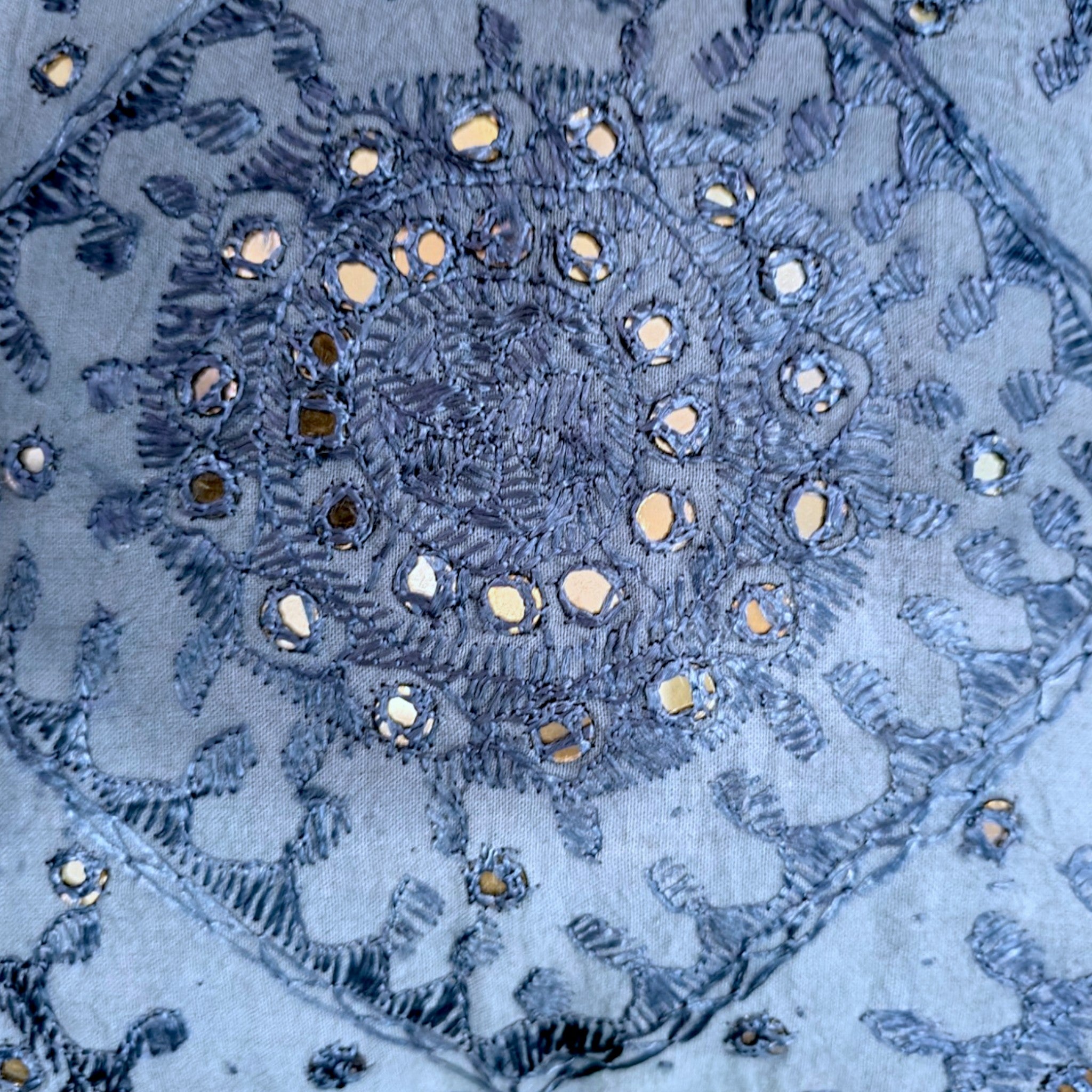 Handcrafted dark blue cushion cover featuring intricate mirror work and embroidery design.