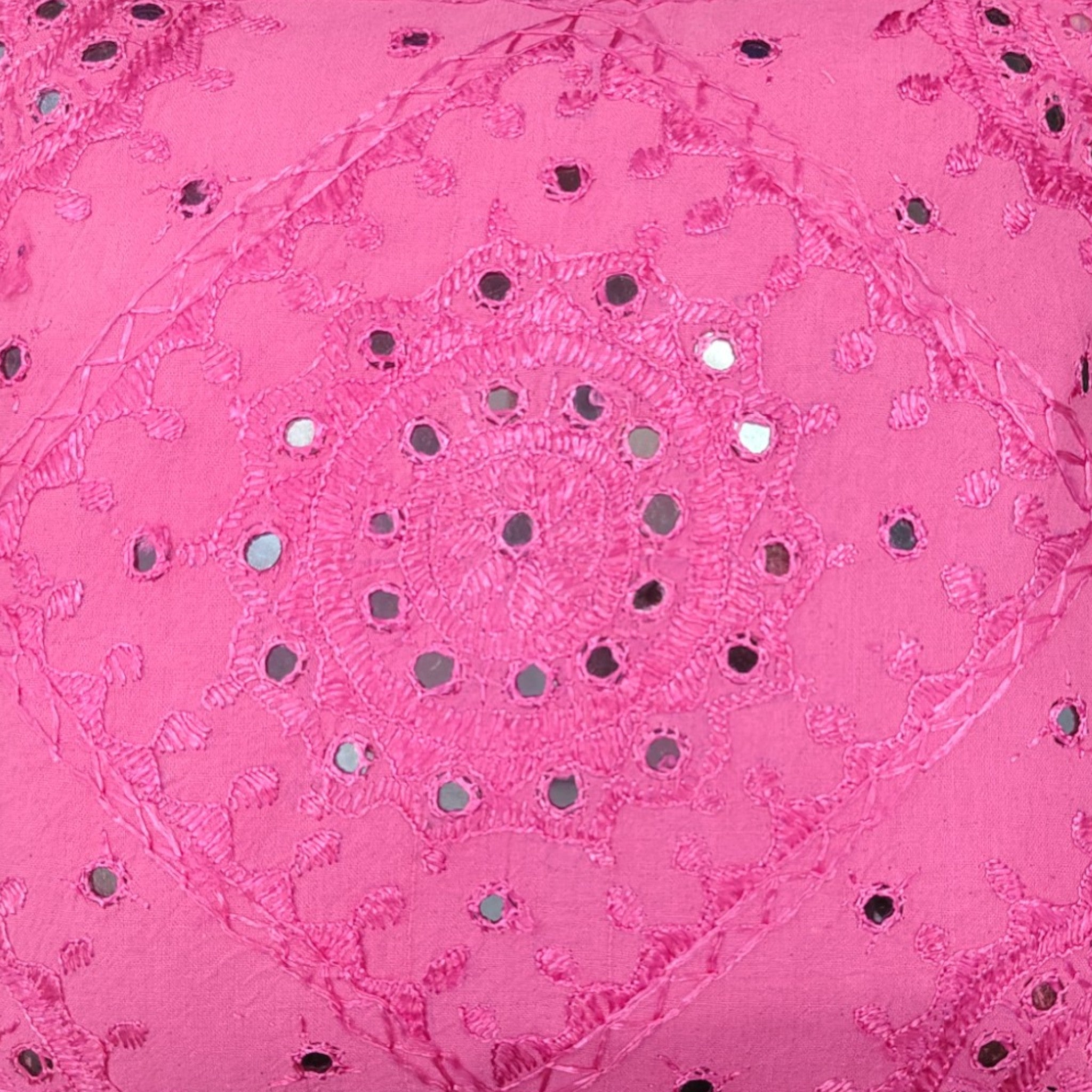 Handcrafted pink cushion cover featuring intricate mirror work embroidery, perfect for decorative pillows.
