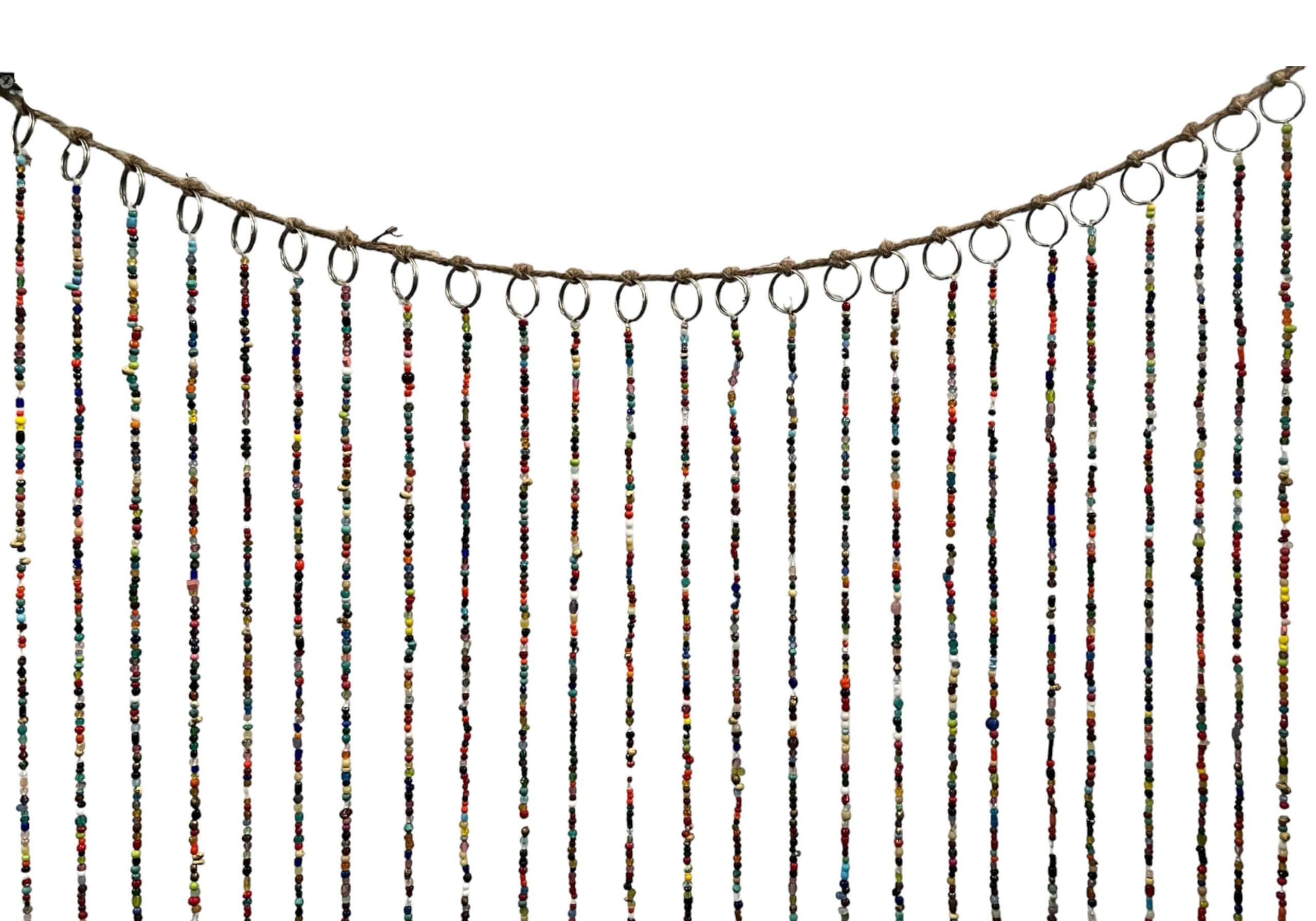 Bohemian beaded doorway garland with multicolored glass beads and jingle bells, perfect for home decor.