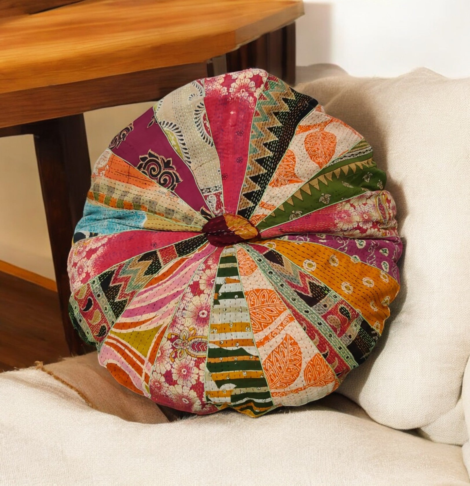 Round multicolor patchwork floor cushion cover featuring Kantha design, perfect for decorative accents and chair pads.