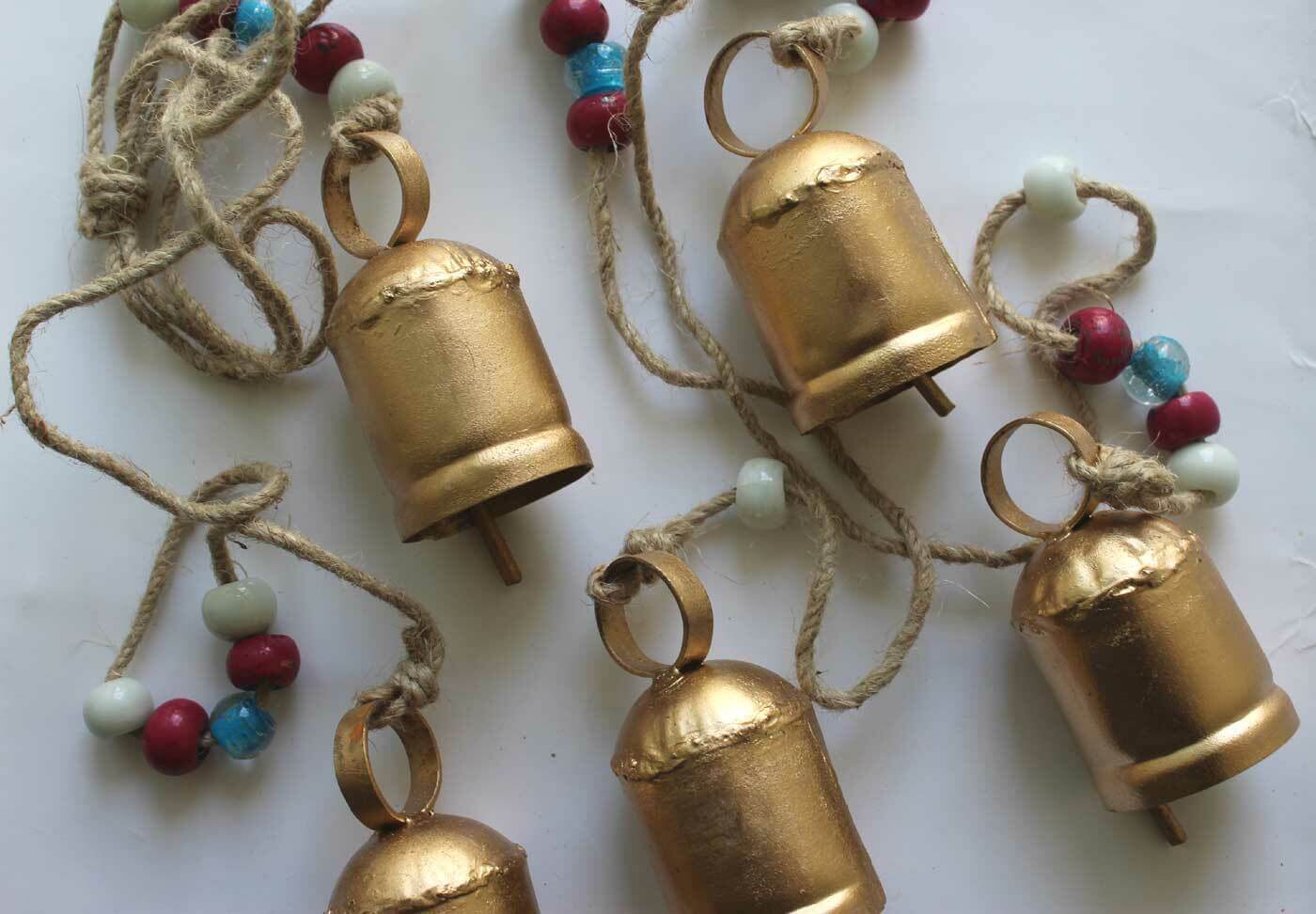 Antique look wind chime bells with colorful beads, perfect for outdoor hanging decor or rustic crafts.