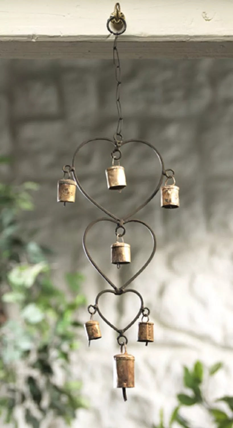 Beautiful handcrafted wind chime made from recycled iron, featuring gold bells. Perfect for home décor or as a thoughtful gift.