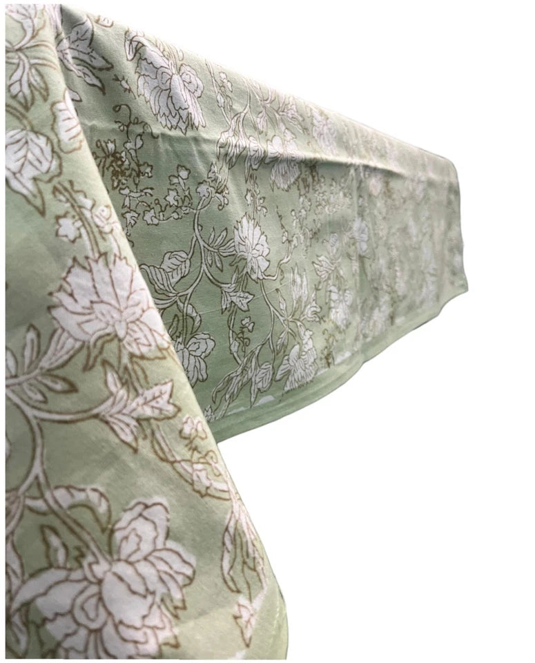 Elegant floral Indian hand block print tablecloth in soft green cotton, perfect for dining and festive occasions.