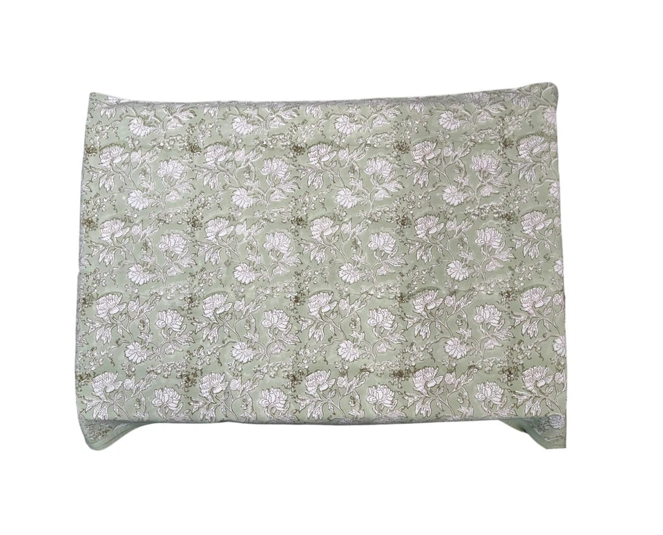 Elegant Indian hand block print tablecloth in soft green with floral design, perfect for dining and special occasions.