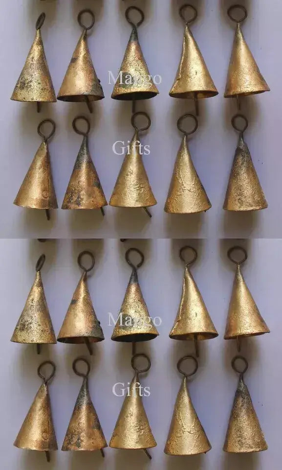 Rustic cone-shaped tin bells in gold, perfect for crafts, decor, and soothing sound in outdoor hanging mobiles.
