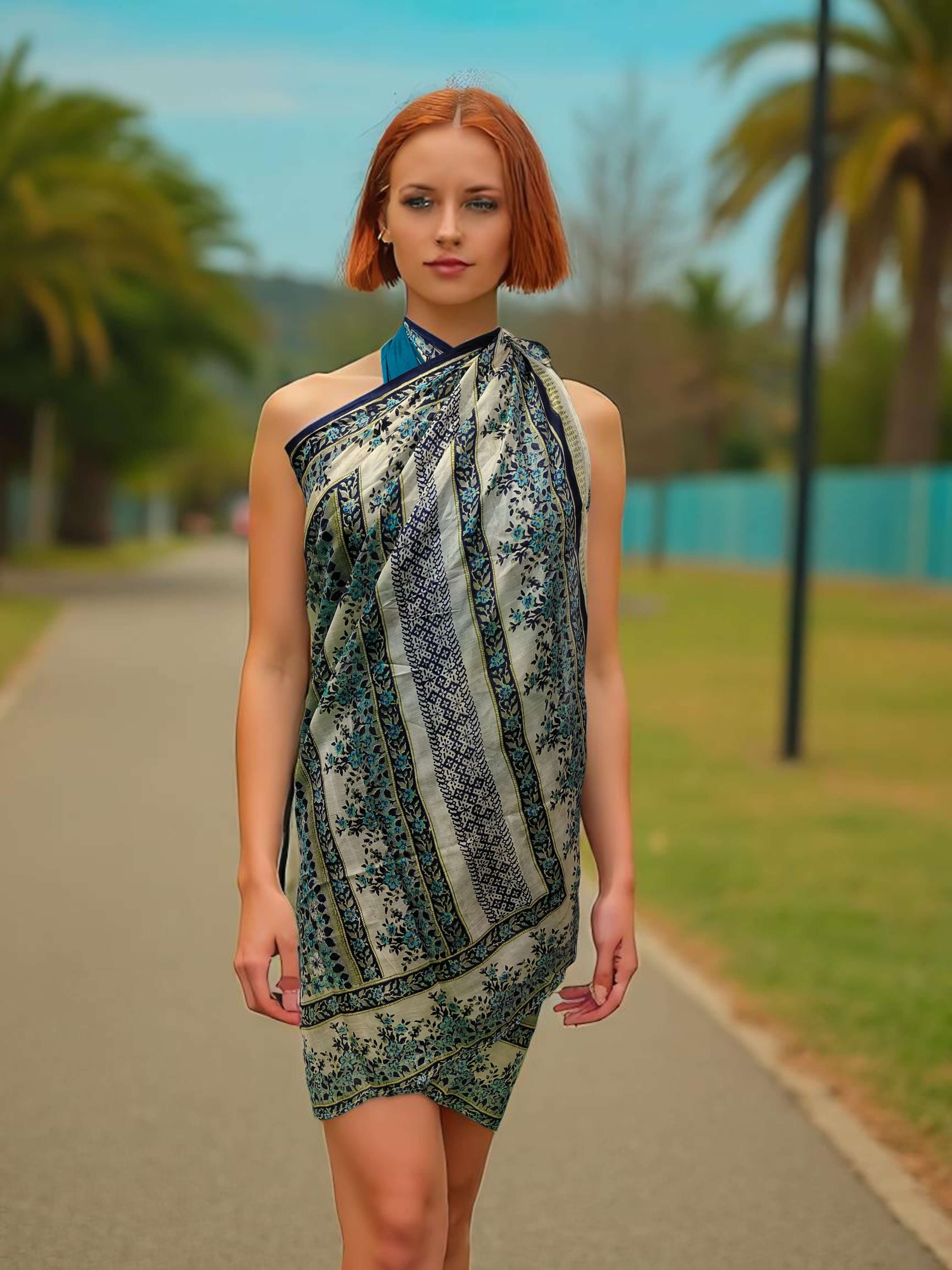 Model wearing a Silk Sari Saree scarf as a stylish beach wrap in a scenic outdoor setting.