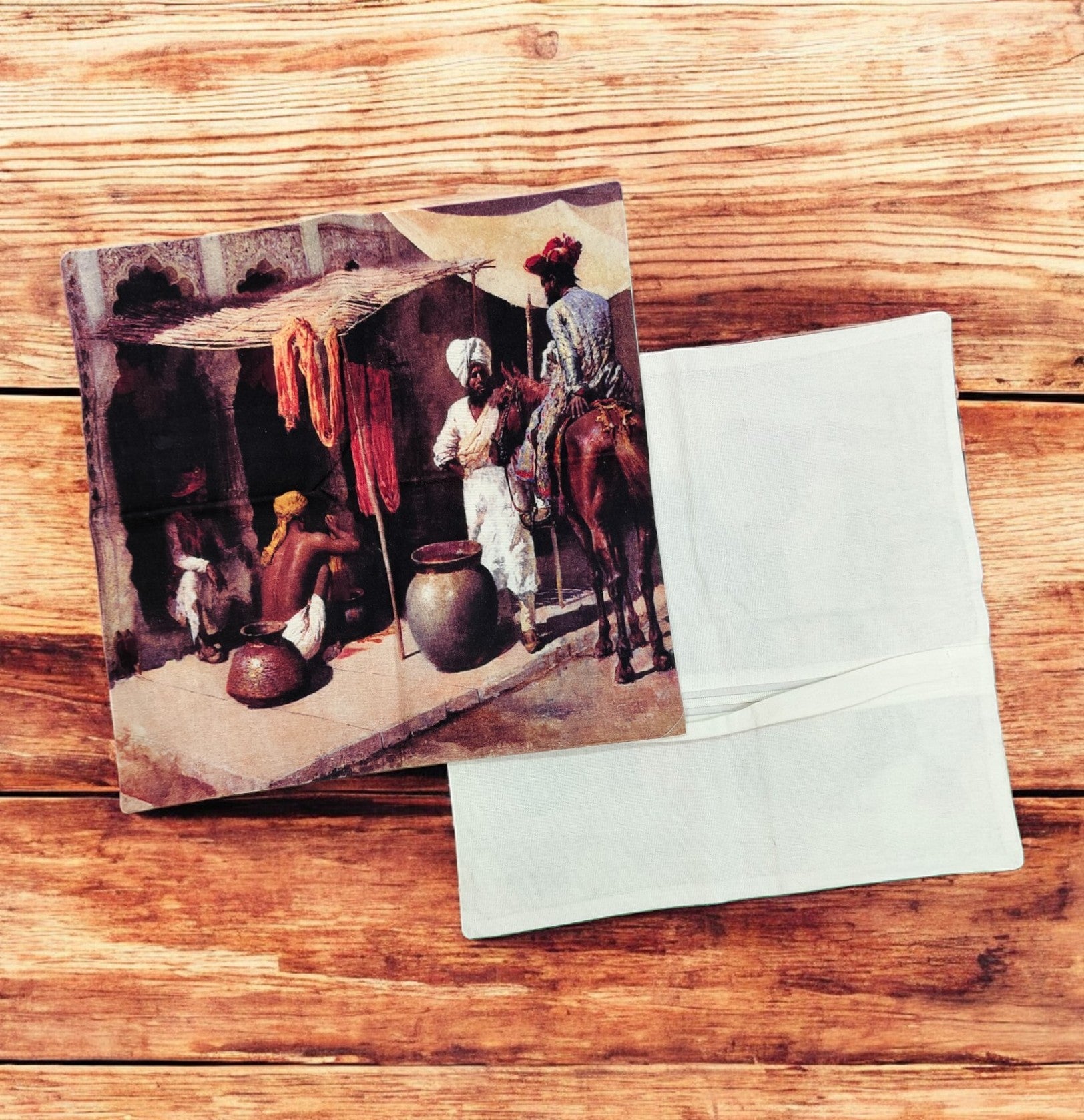 Set of 2 digital print cushion covers featuring a vintage Indian market scene on a wooden background.
