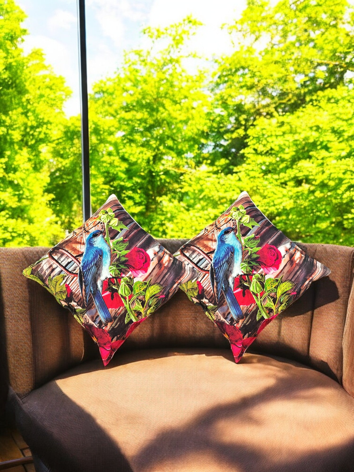 Colorful set of 2 bird digital print cushion covers on a sofa, perfect for outdoor accents and decorative pillows.