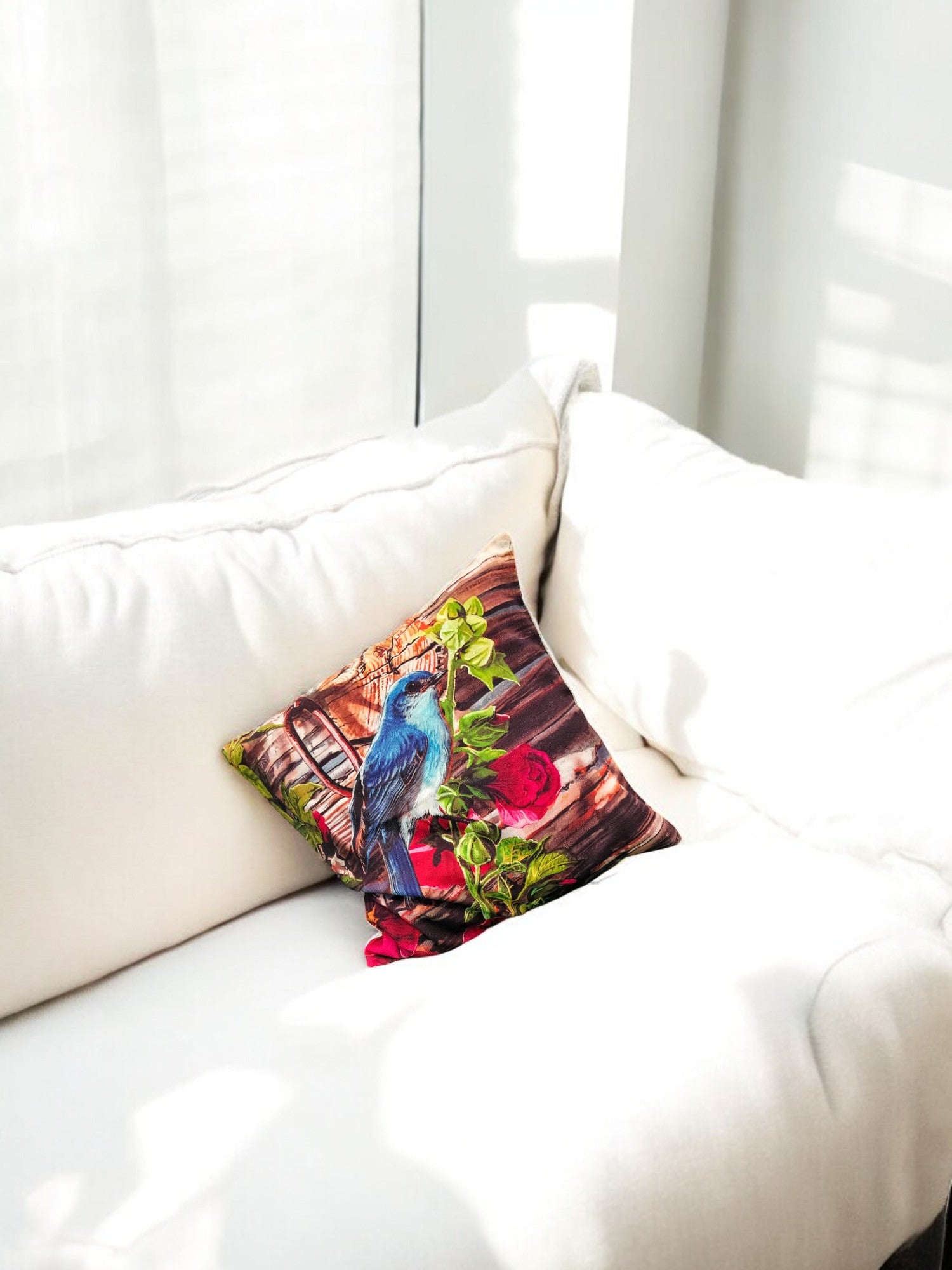 Colorful bird digital print cushion cover on a white sofa, accenting any living space beautifully.