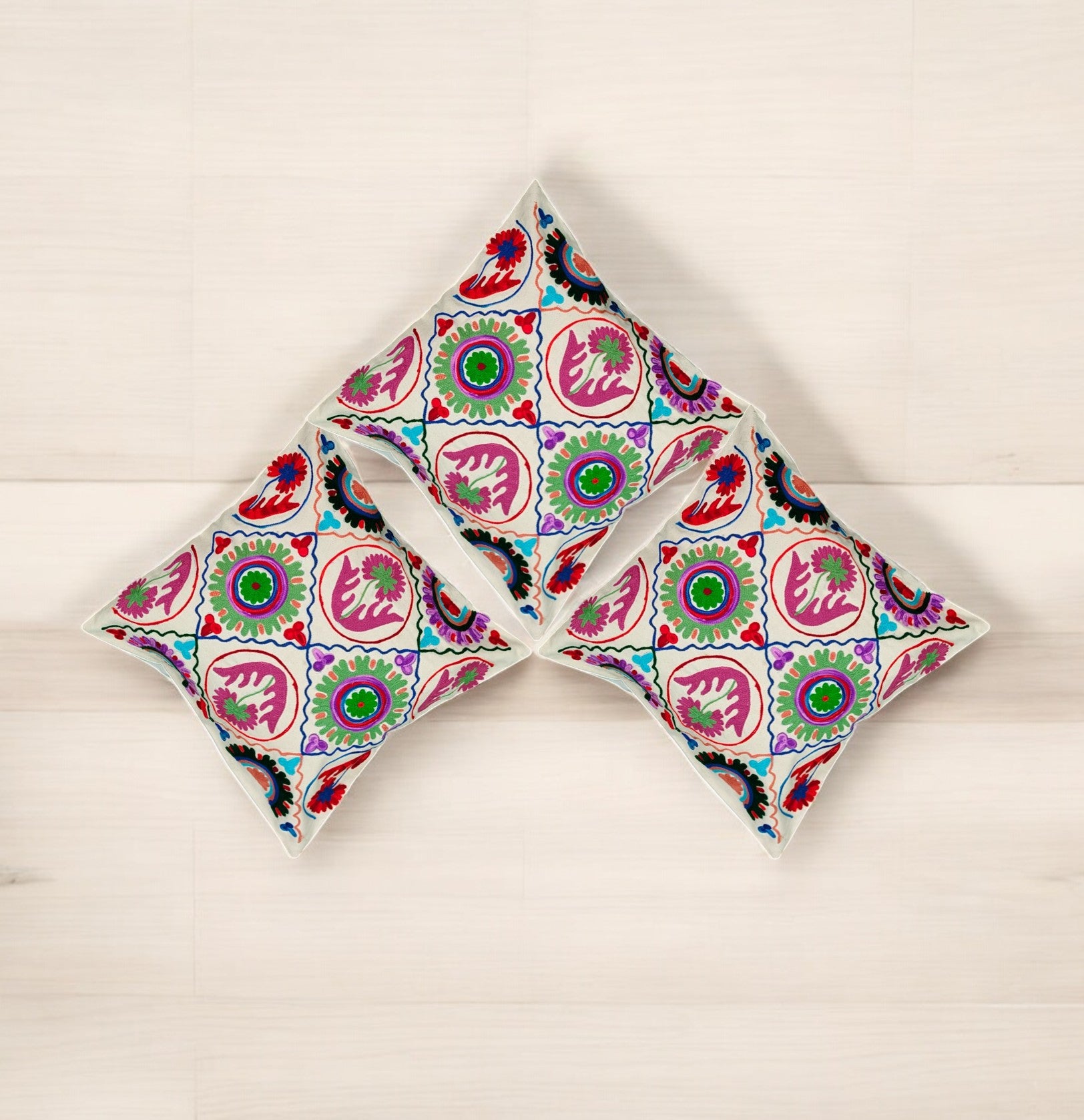 Set of 3 multicolor ethnic Suzani pattern cushion covers, perfect for decorative pillows and couch accents.